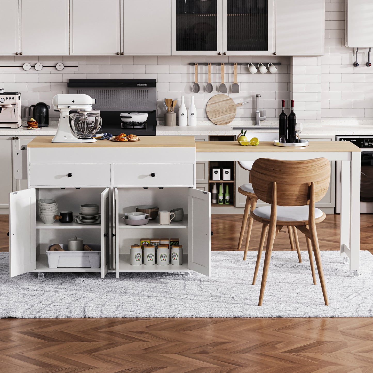 White stand mixer with glass bowl on kitchen island countertop