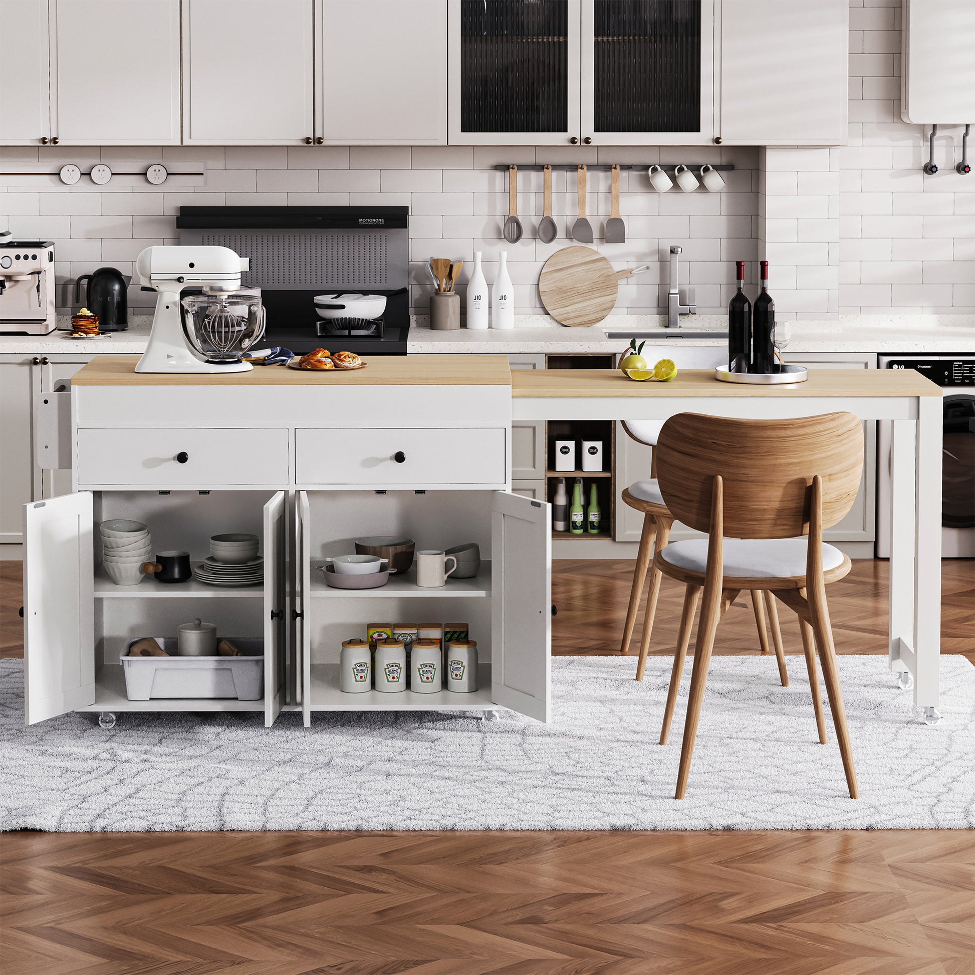 White stand mixer with glass bowl on kitchen island countertop