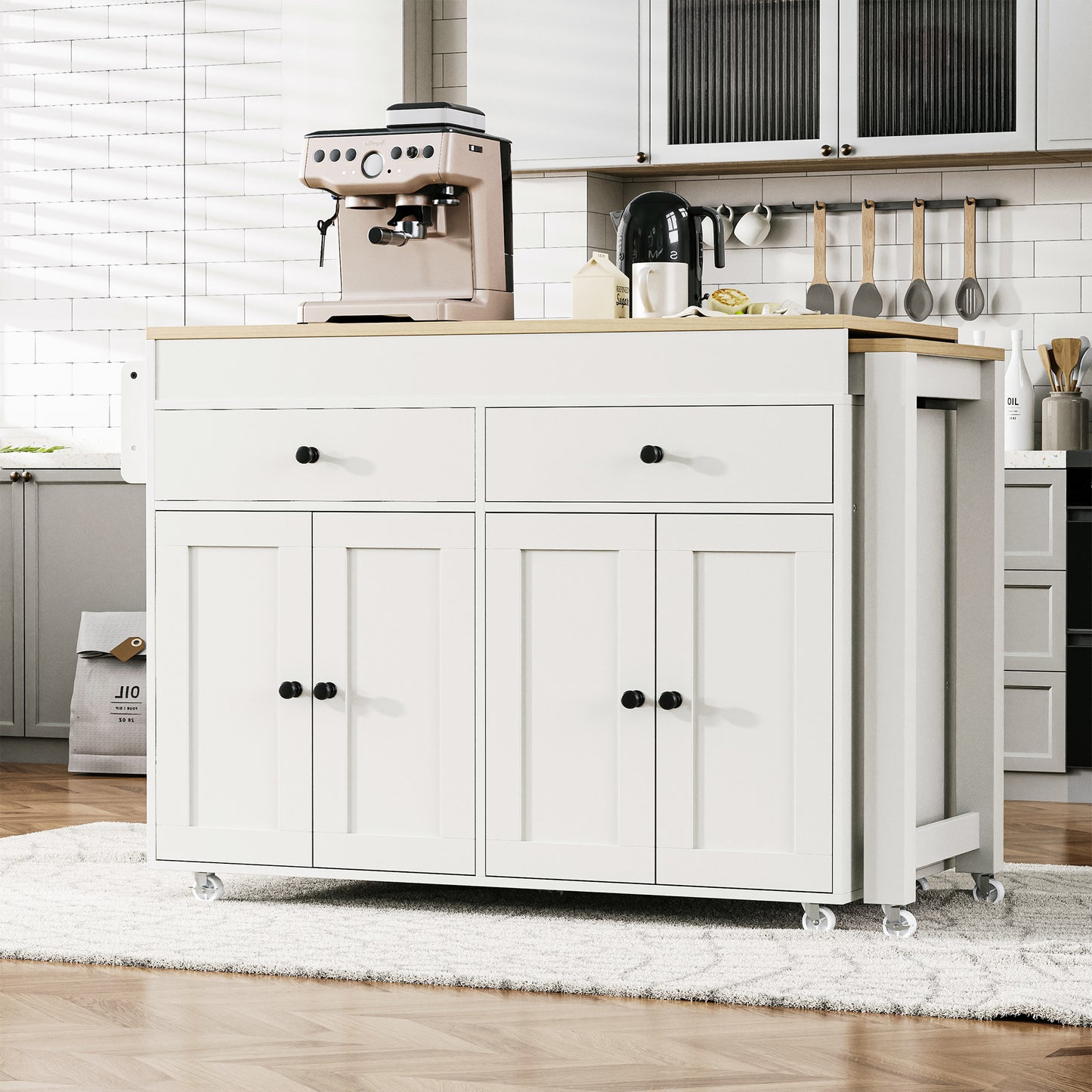 White kitchen island with drop leaf two drawers and two cabinet doors perfect for food prep