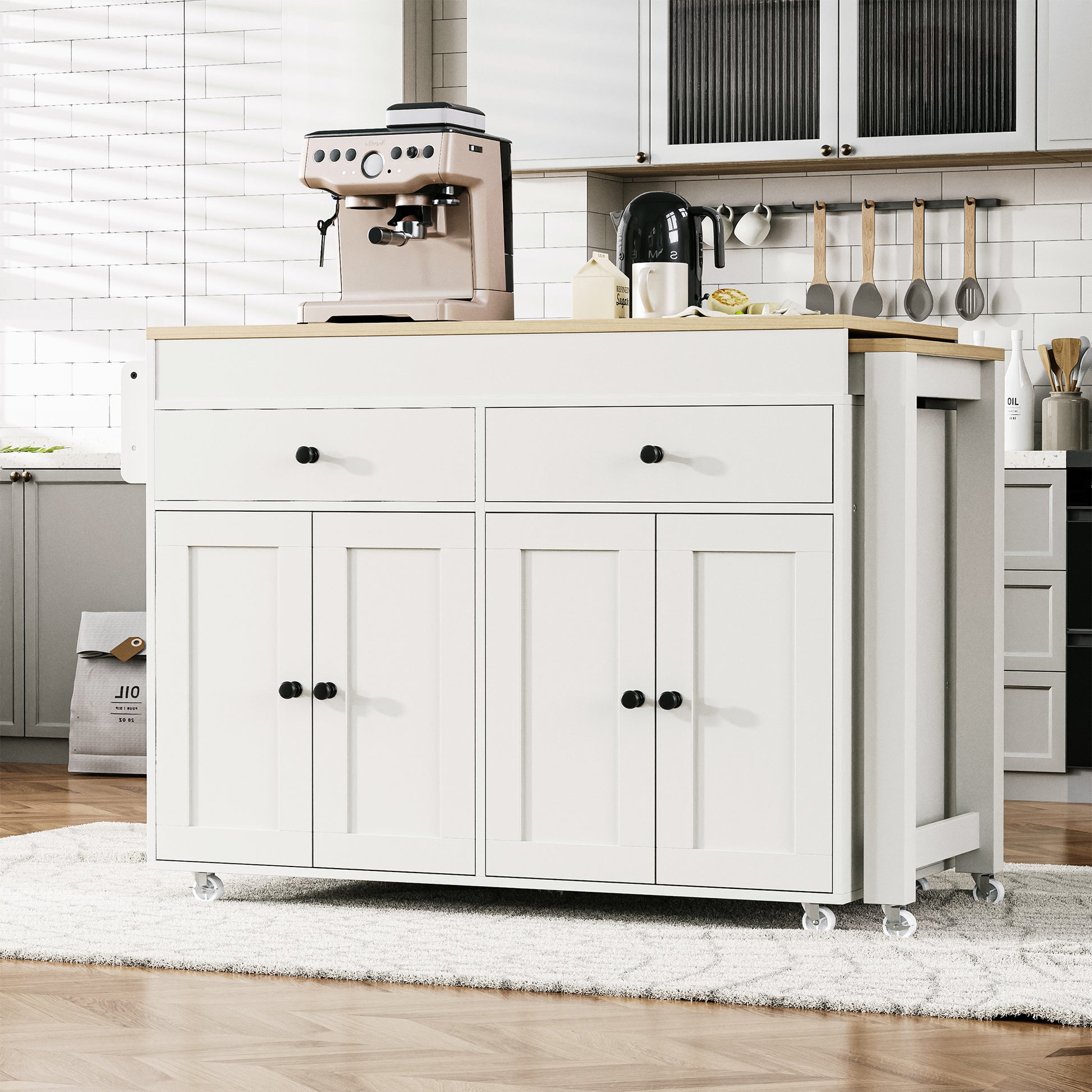 White kitchen island with drop leaf two drawers and two cabinet doors perfect for food prep