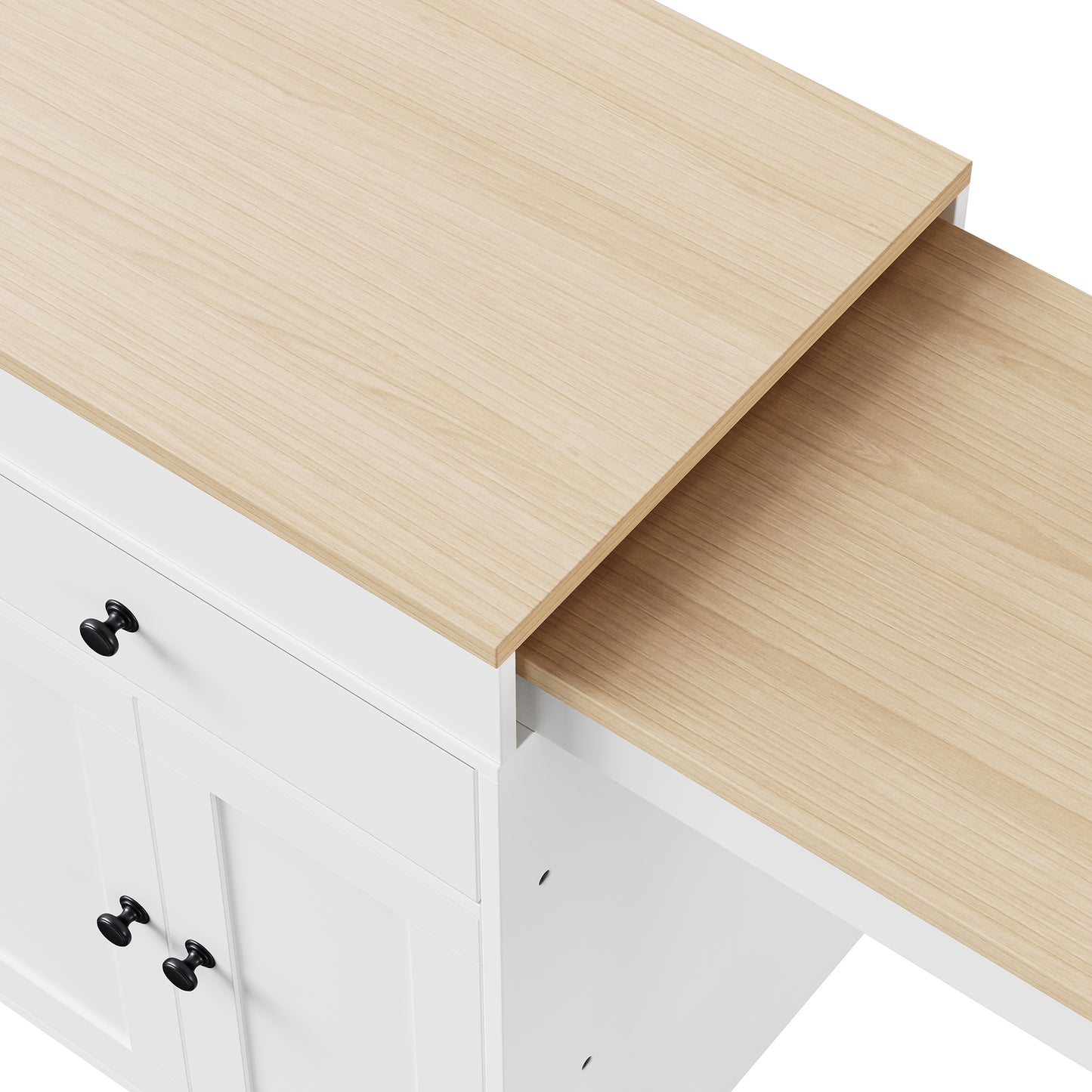 White kitchen island with pullout dining table and black knobs