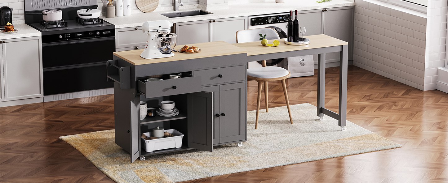 Dark grey kitchen island with butcher block top and open storage shelves showcasing dishes