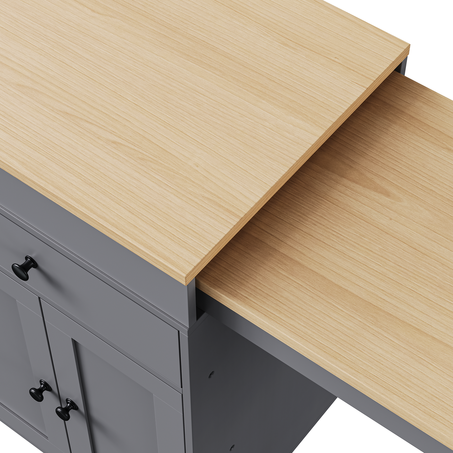 Grey kitchen island cabinet with light oak pullout countertop and black hardware