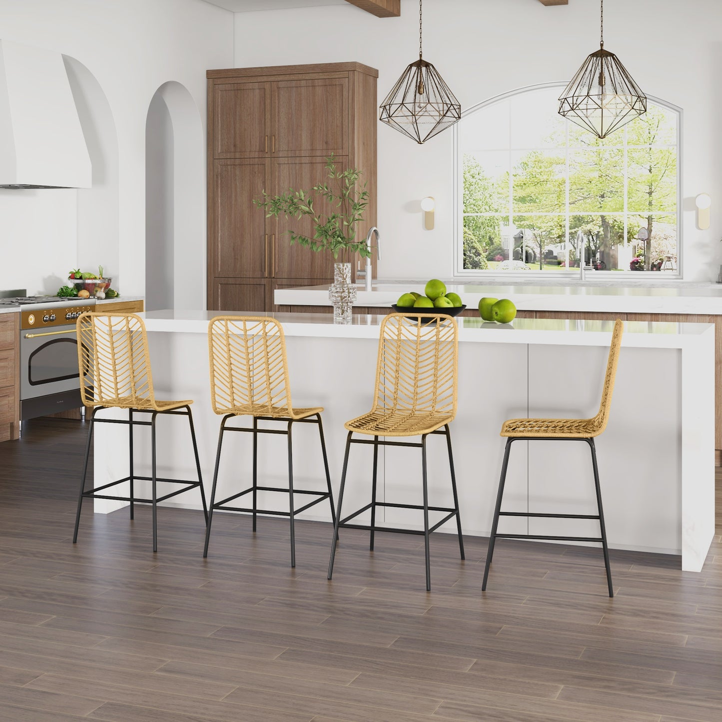 Four natural rattan bar stools with black metal legs arranged around a kitchen island