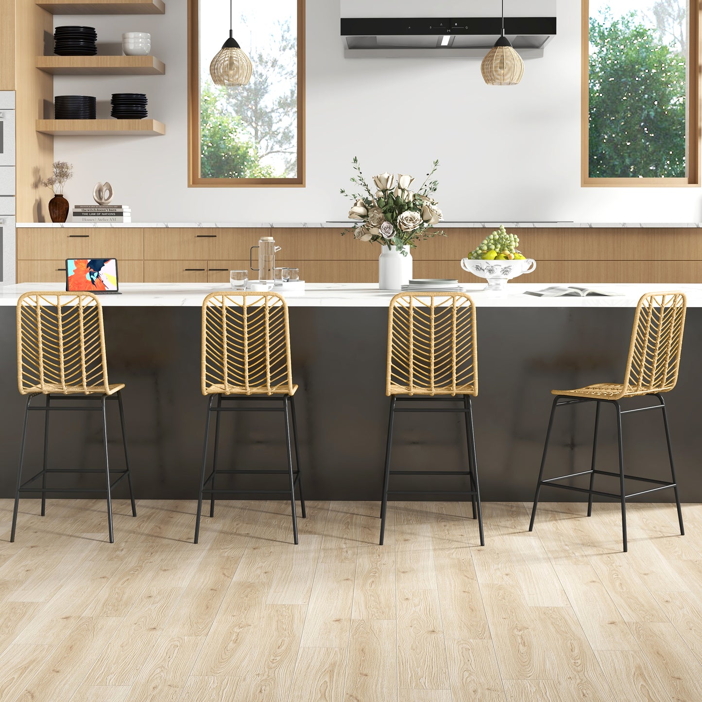 Four natural rattan bar stools with black metal legs in a modern kitchen