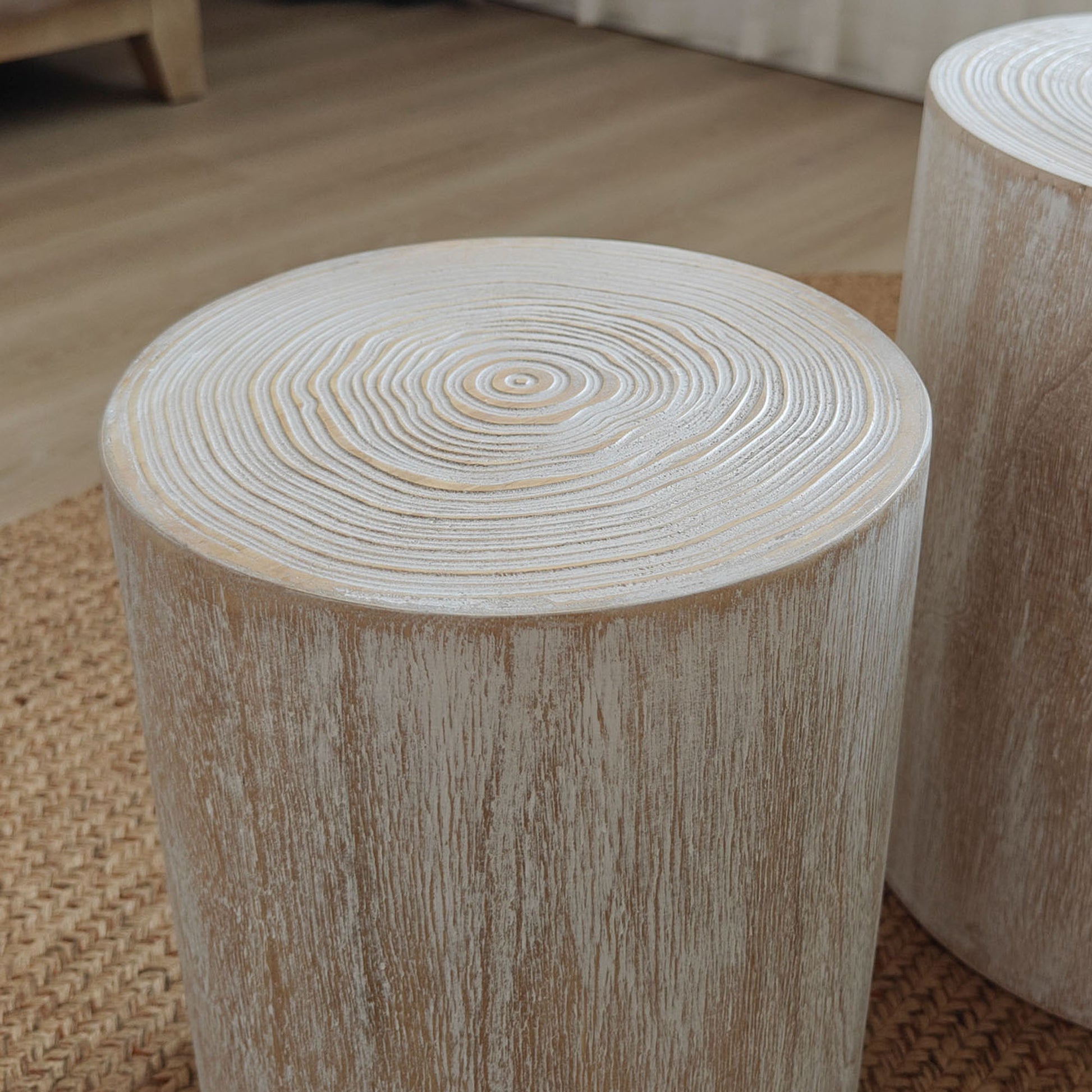 Whitewashed wood slice side table with natural grain texture