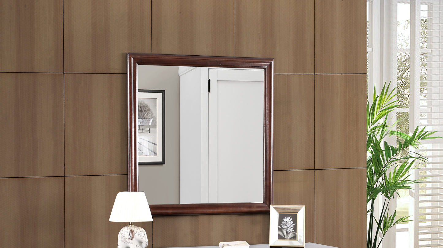 Ornate mahogany framed rectangular wall mirror with beveled glass