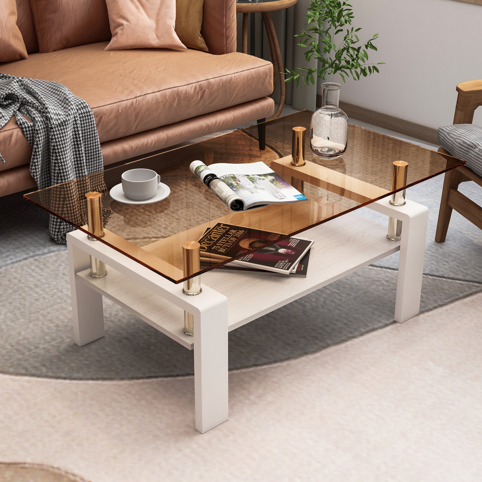 Modern glass coffee table with white base and brass accents featuring a lower shelf for storage