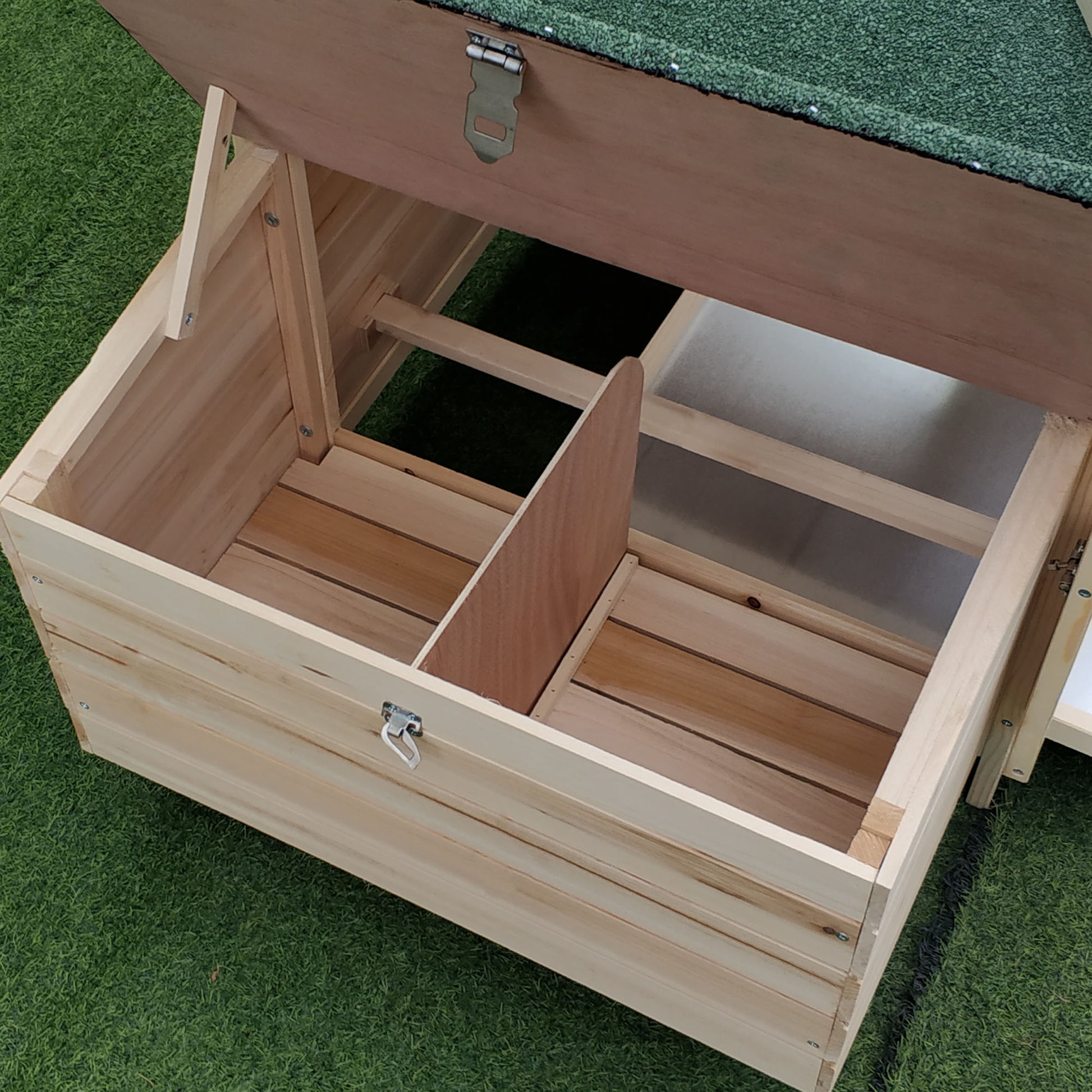 Wooden coop interior with two nesting boxes and a slatted floor