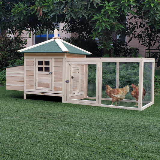 Two brown hens in a wooden chicken coop with an attached run