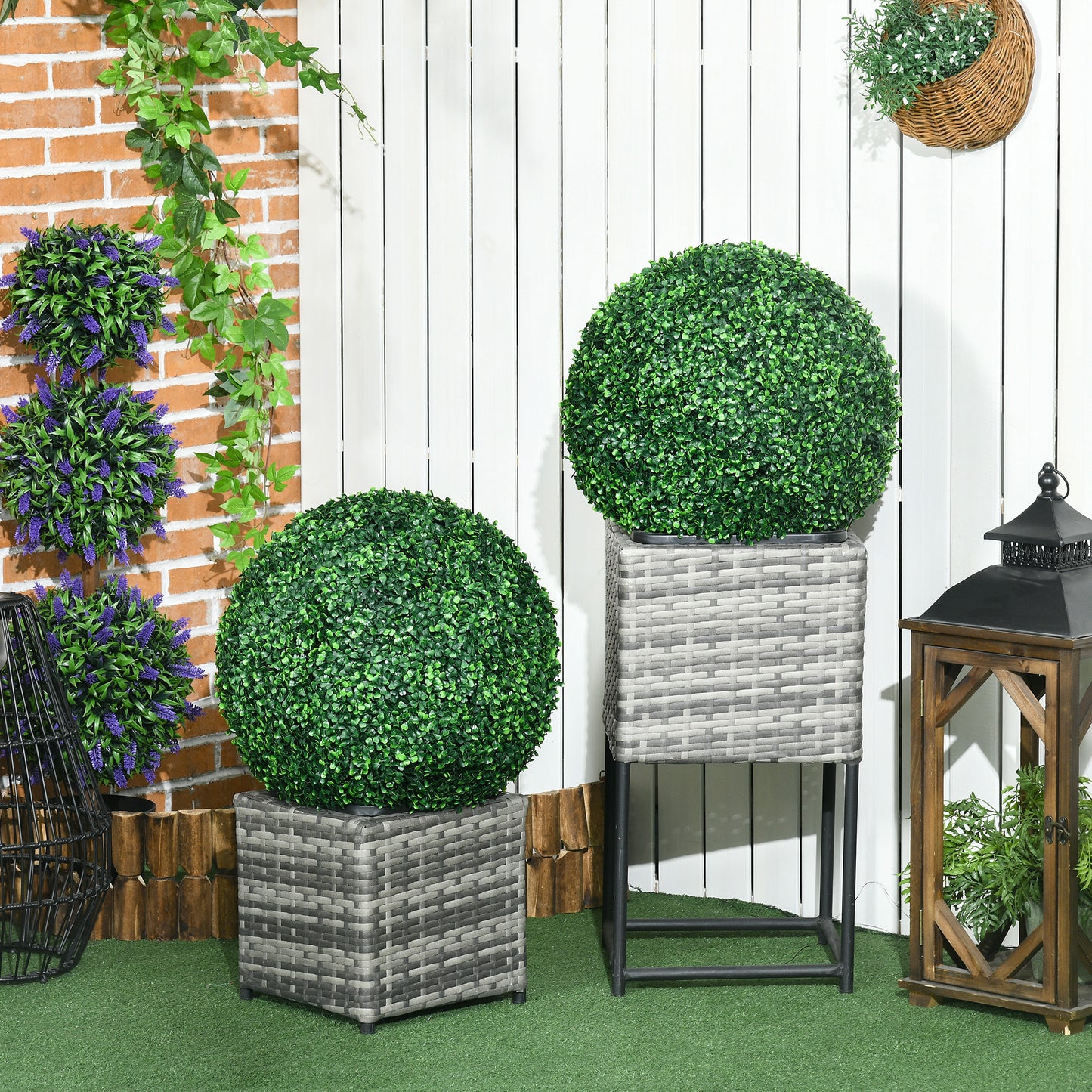 Round green artificial boxwood topiary in a gray woven planter pot