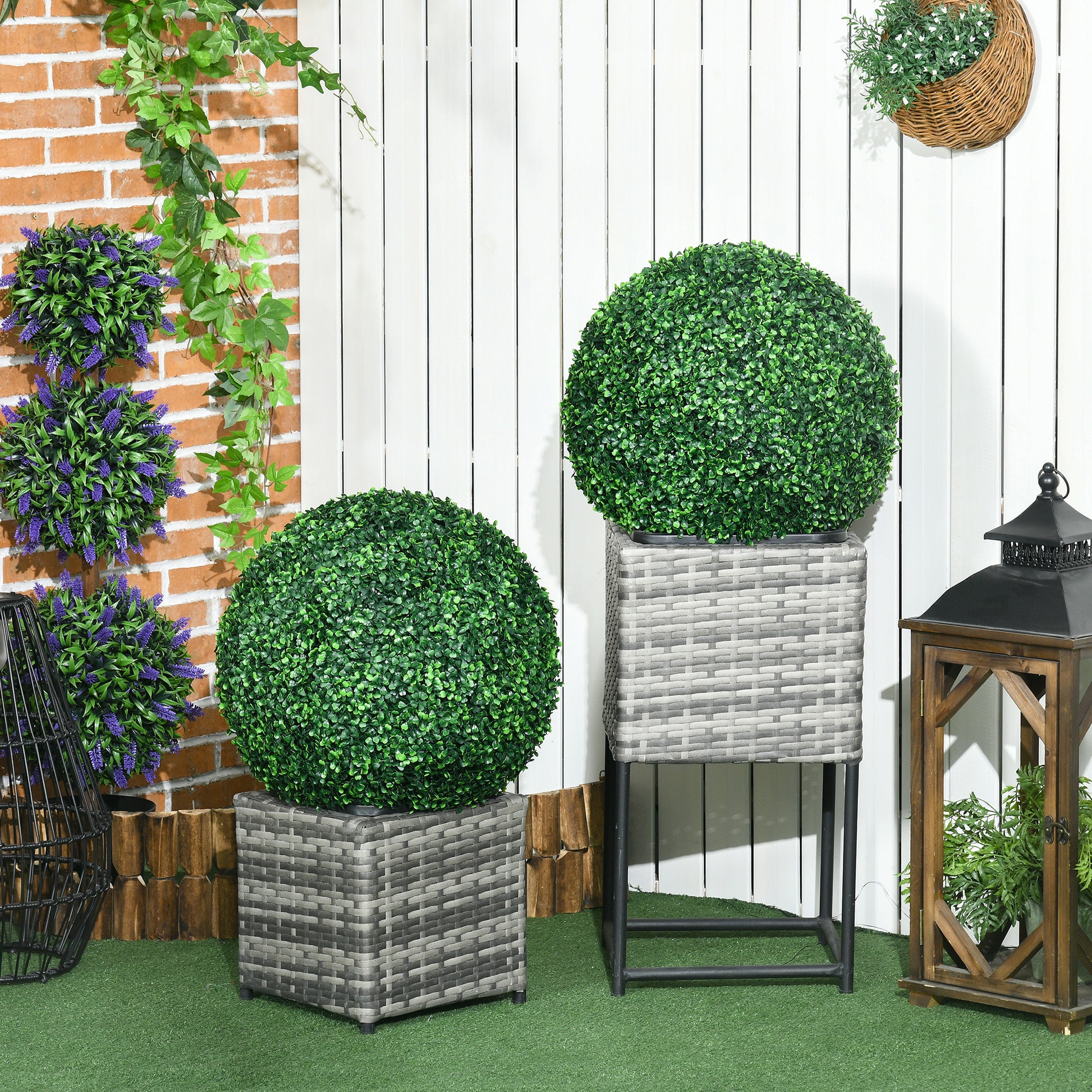 Round green artificial boxwood topiary in a gray woven planter pot