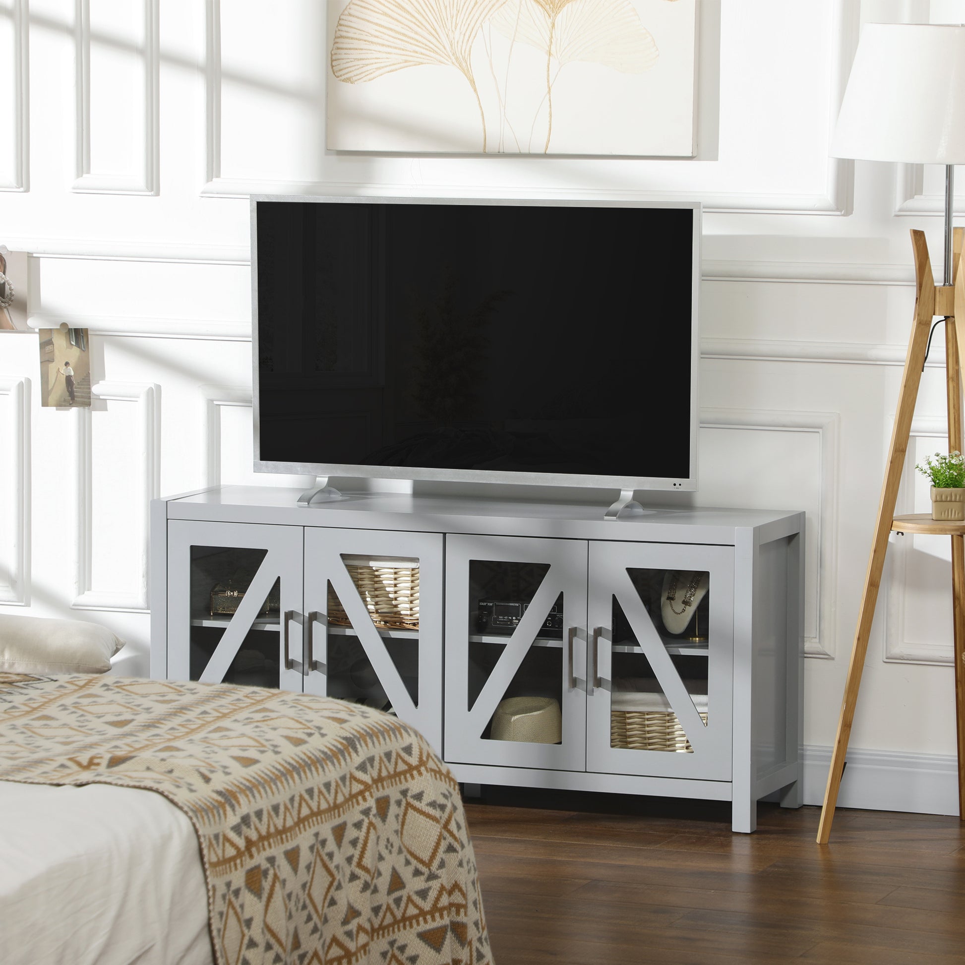 Gray farmhouse TV stand with glass doors and Xshaped trim fits up to inch TVs
