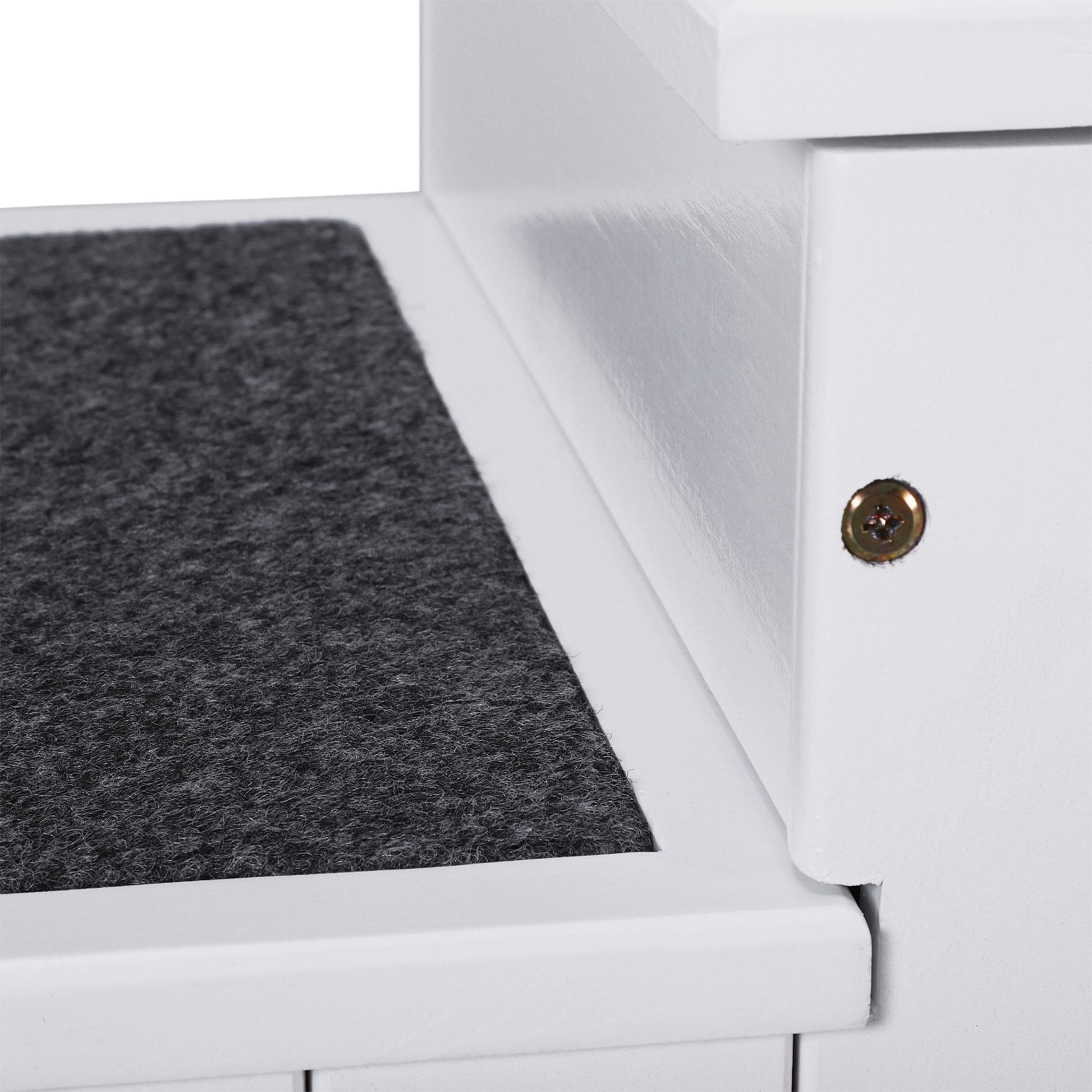 White pet stairs with dark gray carpeted steps for secure climbing