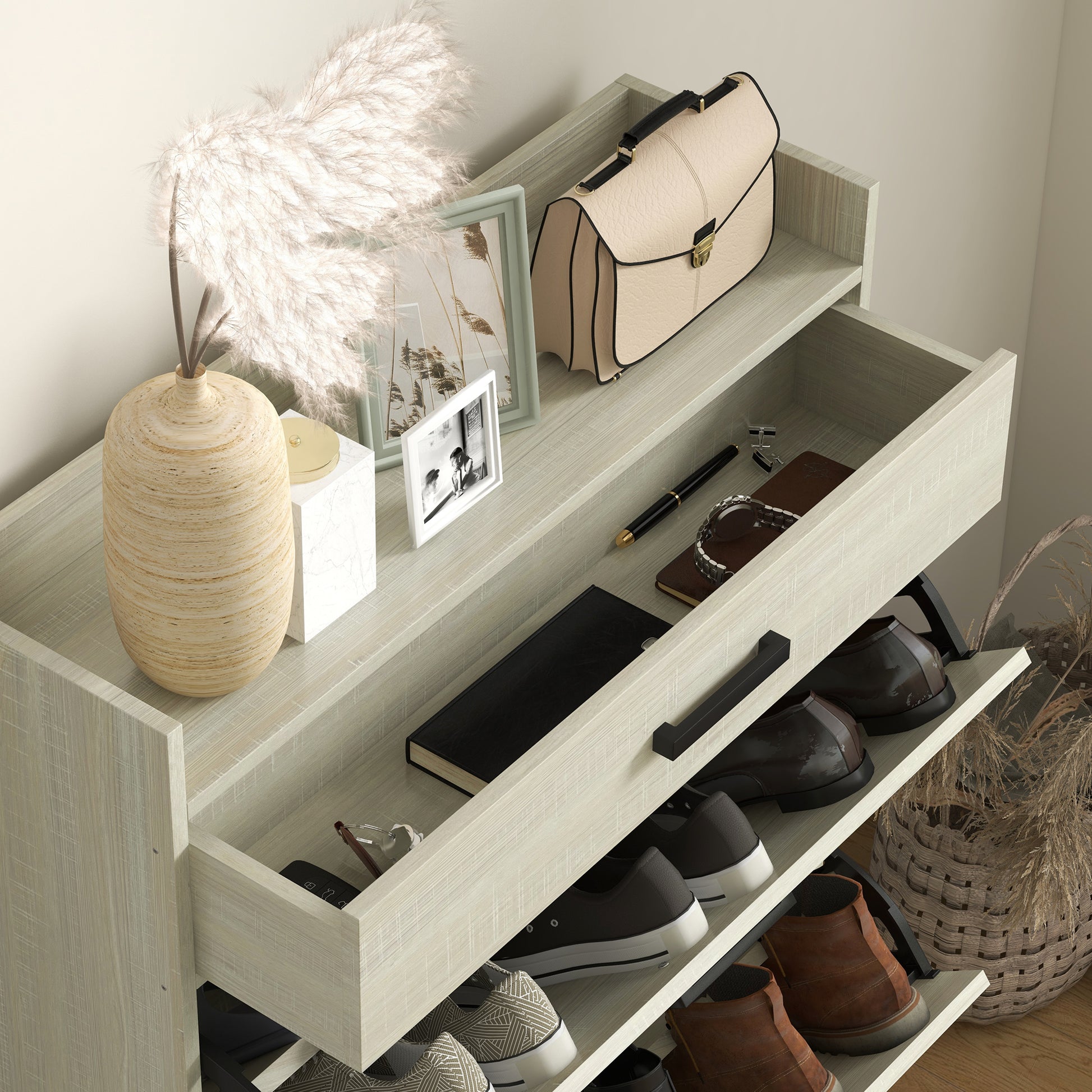 Beige leather handbag with black trim and gold clasp on entryway organizer shelf