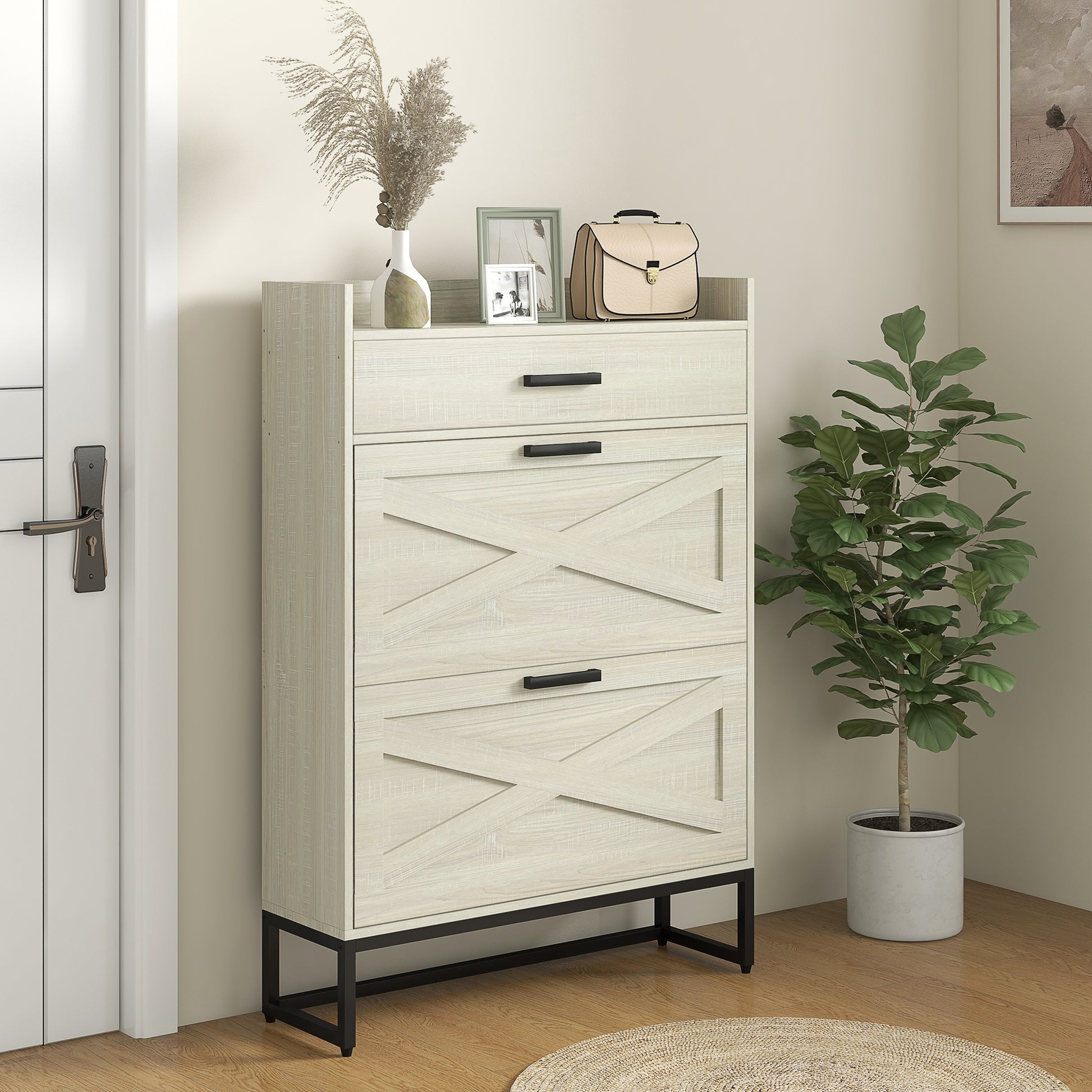 White wood shoe cabinet with crisscross door design and black handles