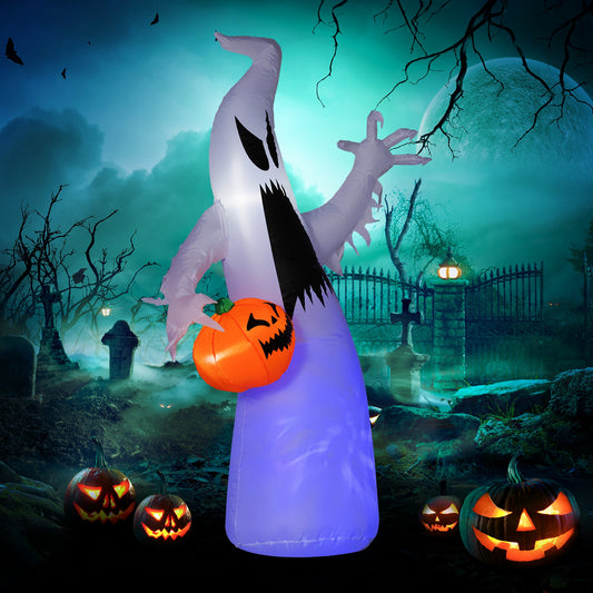 Inflatable ghost holding a jackolantern in a spooky graveyard scene