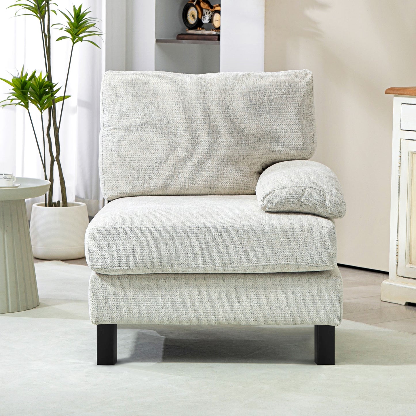Textured light beige armchair with dark square legs and a removable cushion