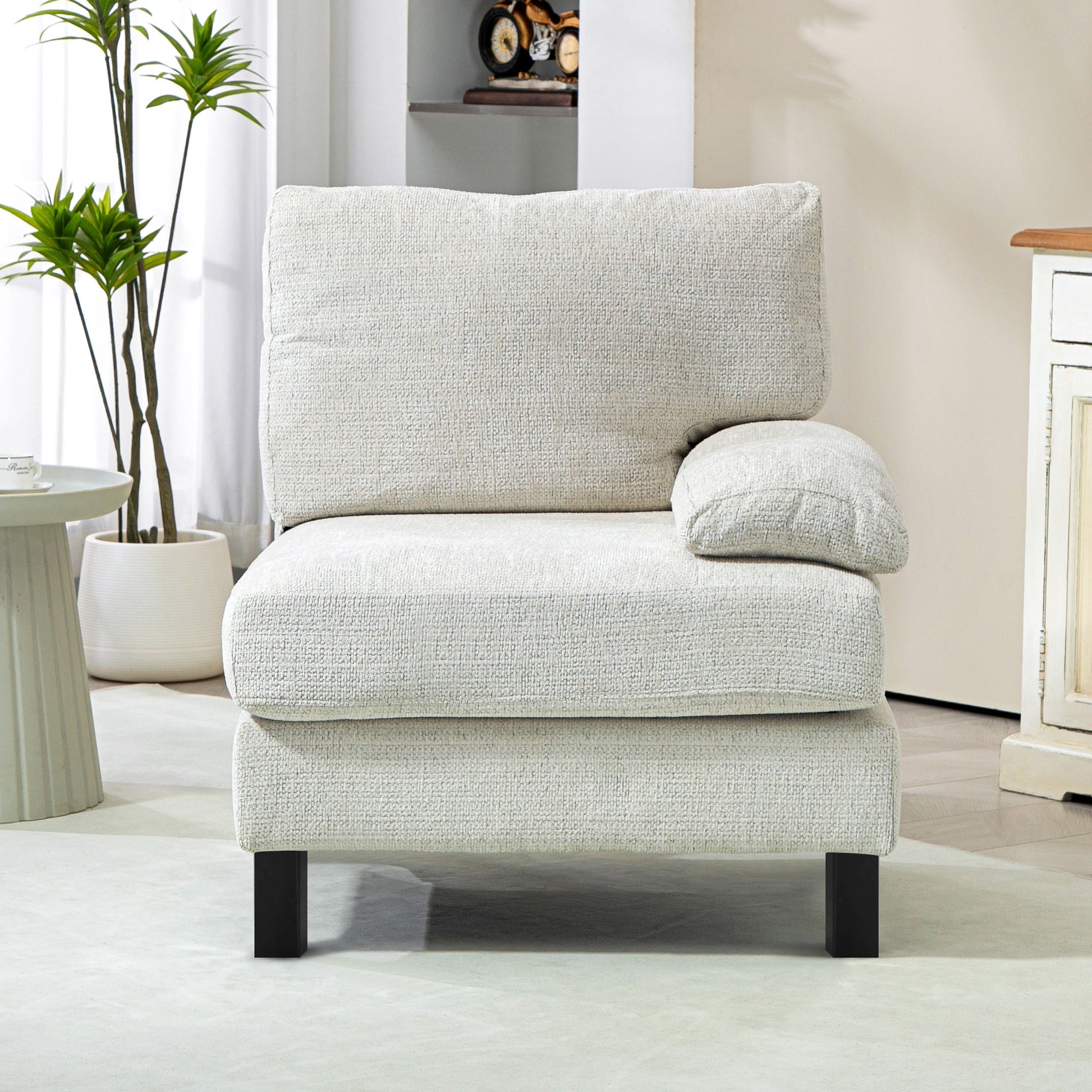 Textured light beige armchair with dark square legs and a removable cushion
