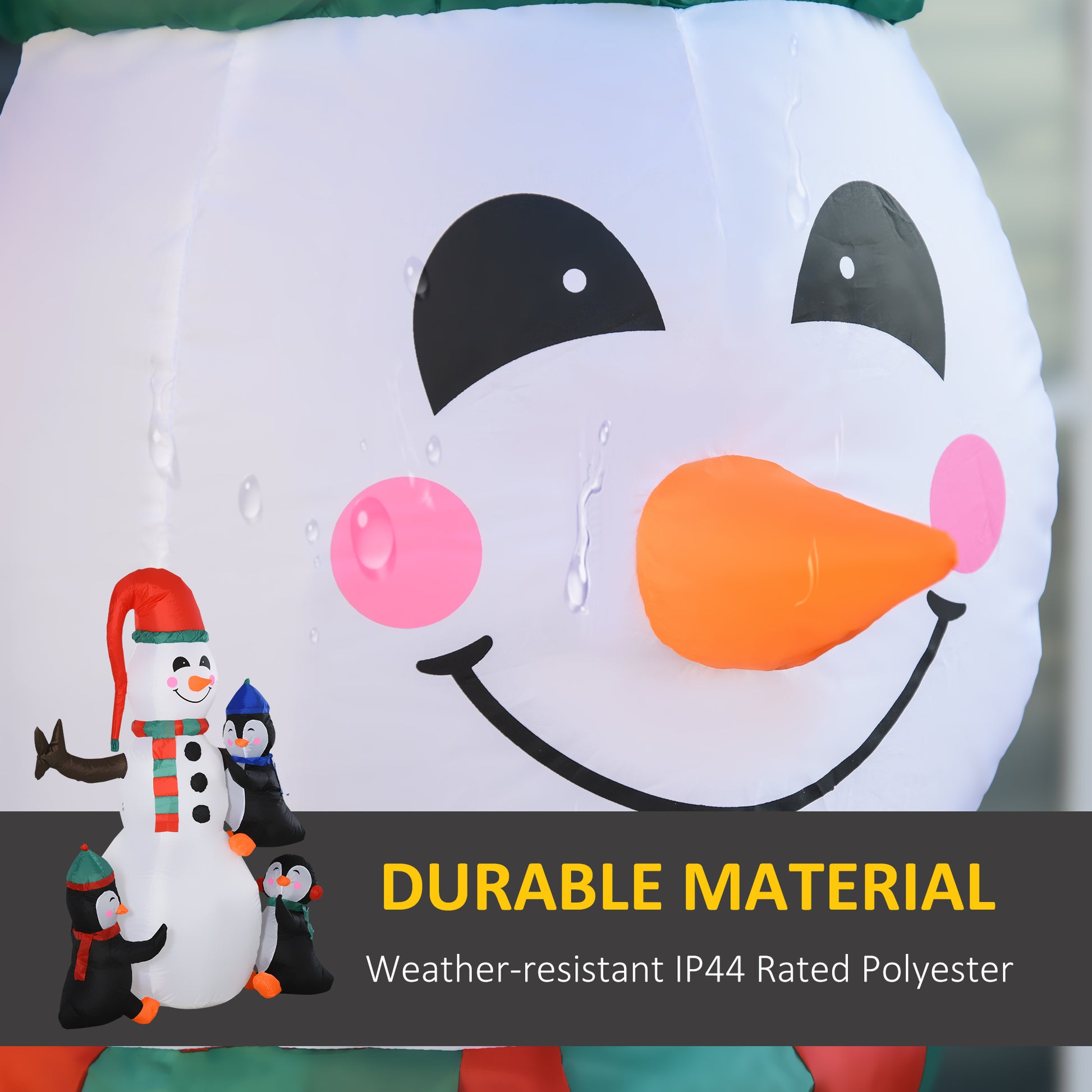 Inflatable snowman with penguins featuring red hat and green scarf