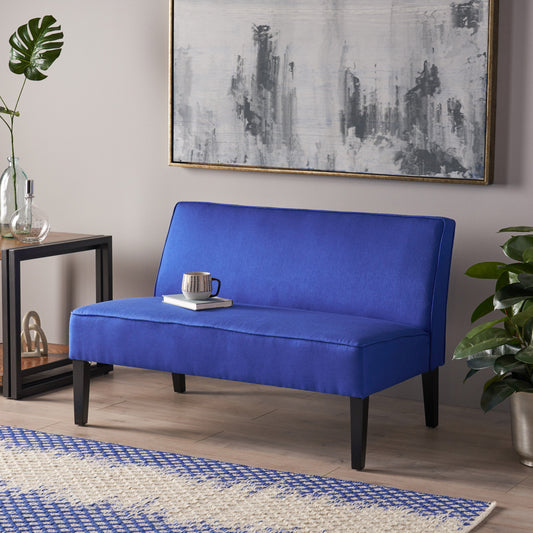 Compact blue accent chair with clean lines and dark wooden legs