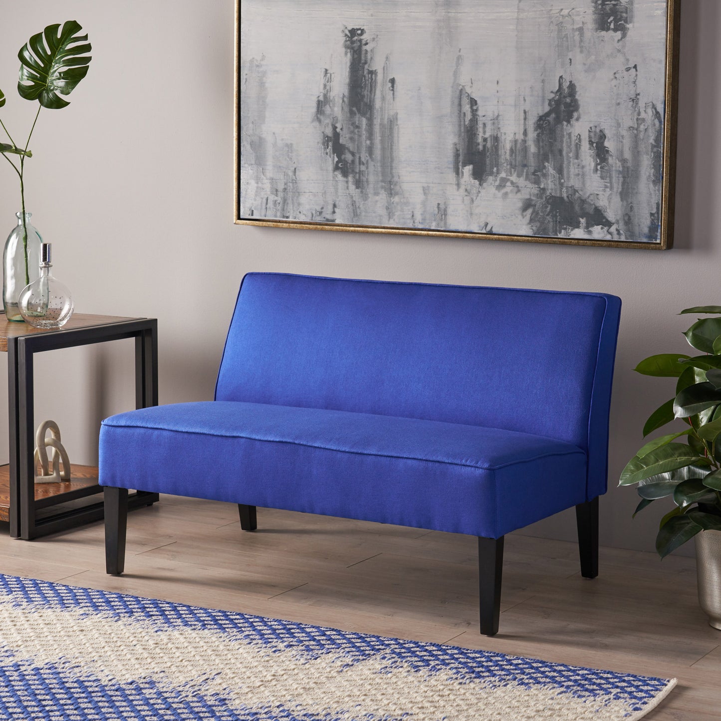 Royal blue upholstered loveseat with black legs modern accent seating