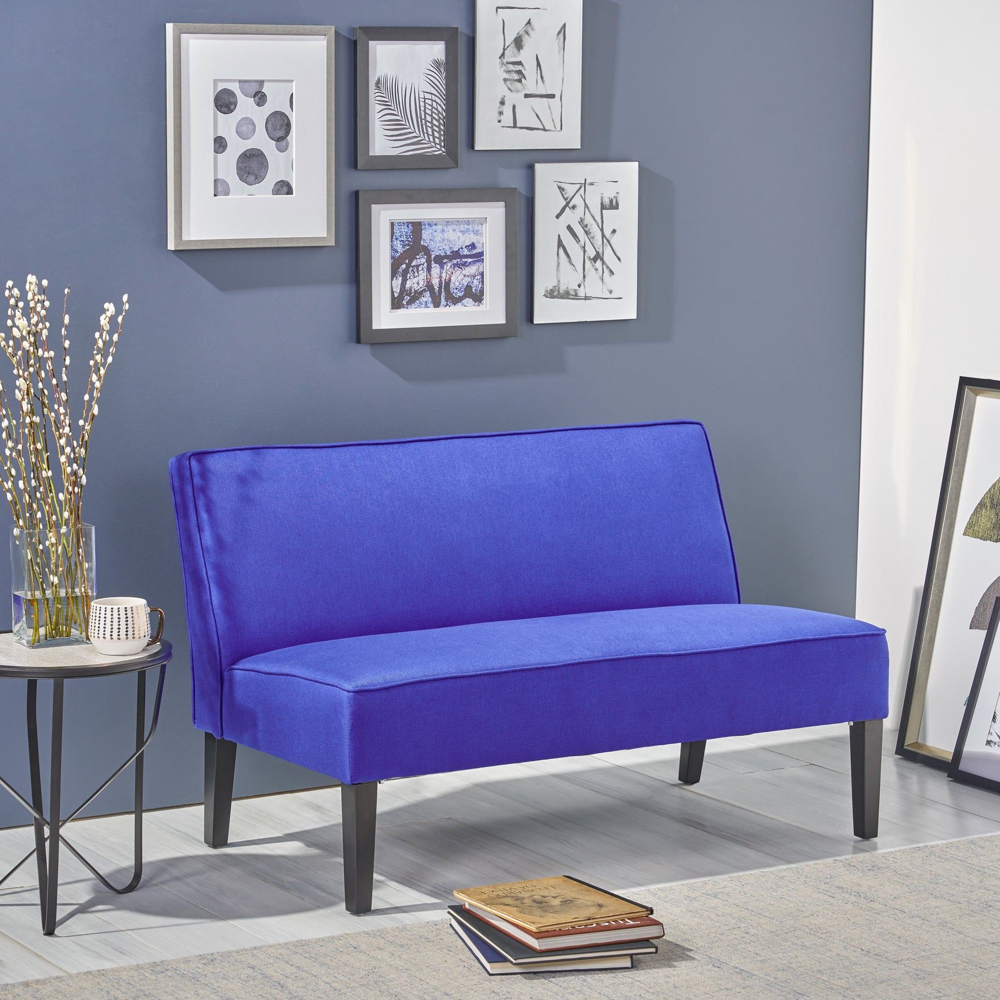 Vibrant blue upholstered bench with clean lines perfect for modern living rooms