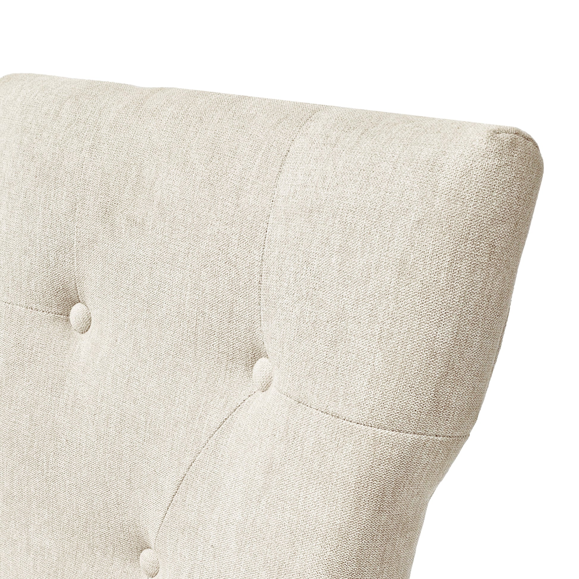 Tufted beige fabric armchair detail showing diamond stitching and button accents for elegant seating