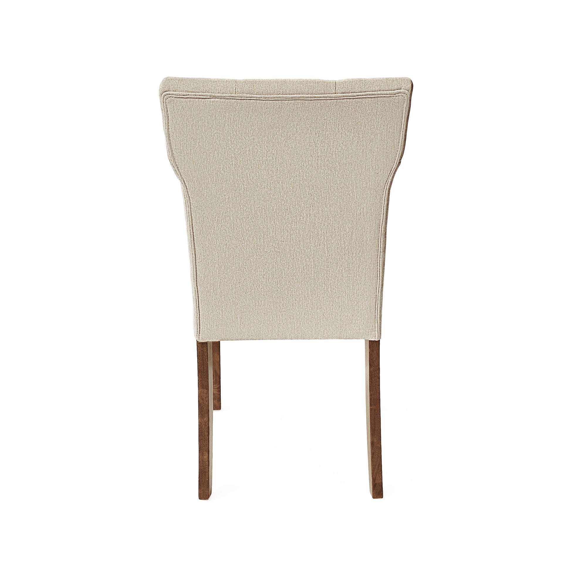 Back view of a beige upholstered dining chair with tufted detail and wooden legs