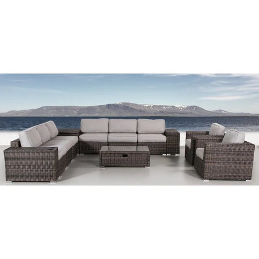 Brown wicker sectional patio furniture set with grey cushions and coffee table