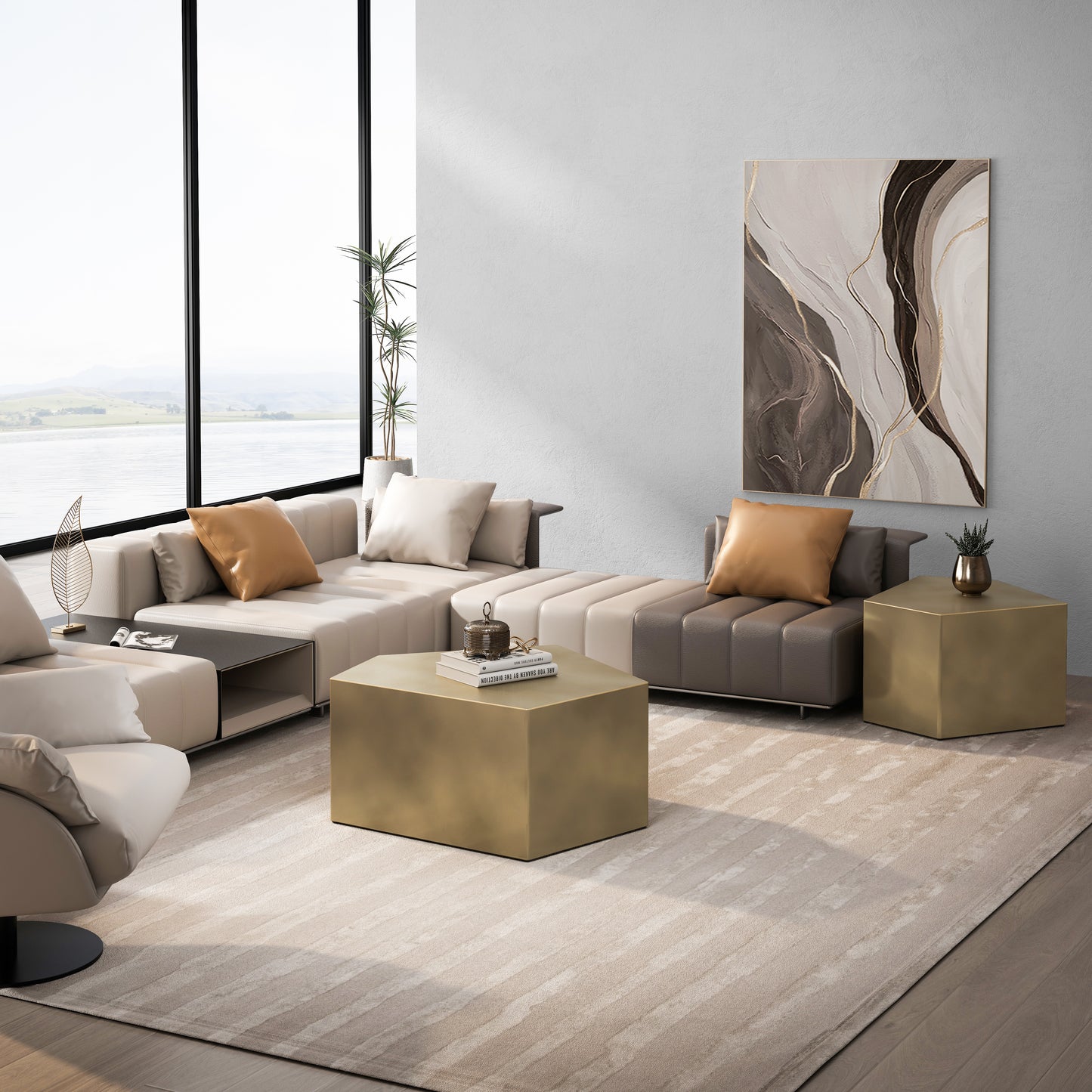 Modular sectional sofa in cream and taupe leather with decorative pillows and a gold hexagonal coffee table