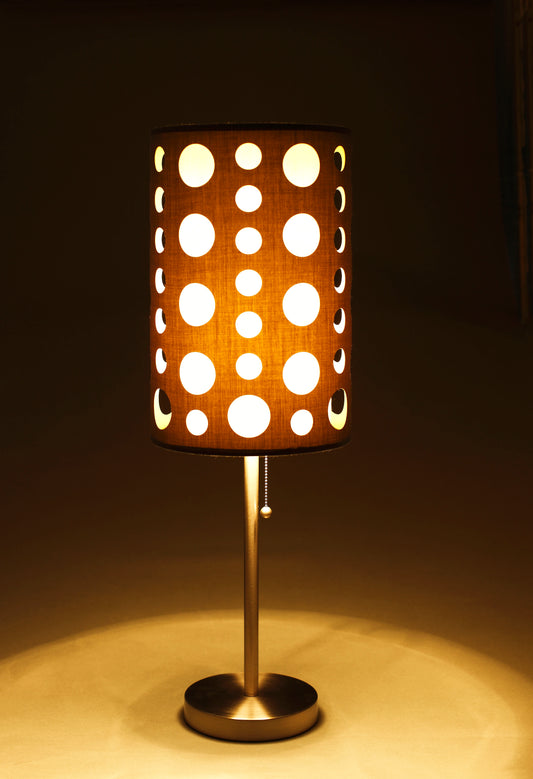 Polka dot patterned fabric table lamp with warm light perfect for ambient bedside lighting