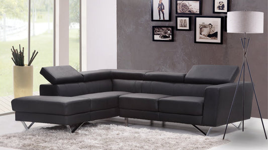 Modern dark grey leather sectional sofa with adjustable headrests and chrome legs
