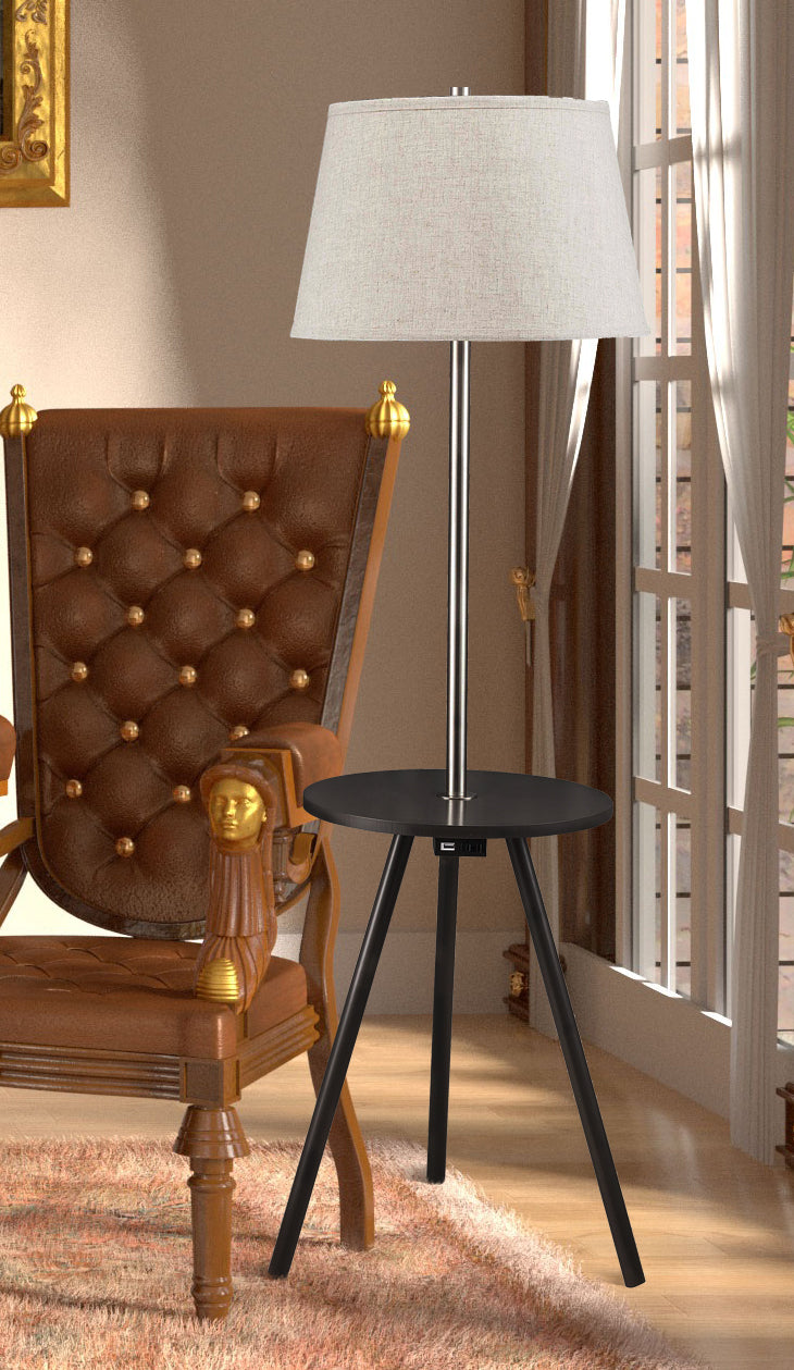 Modern tripod floor lamp with a round black table brushed steel pole and linen shade