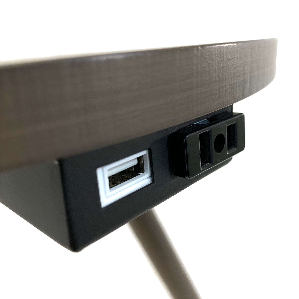 Dark wood side table with integrated power outlet and USB charging port