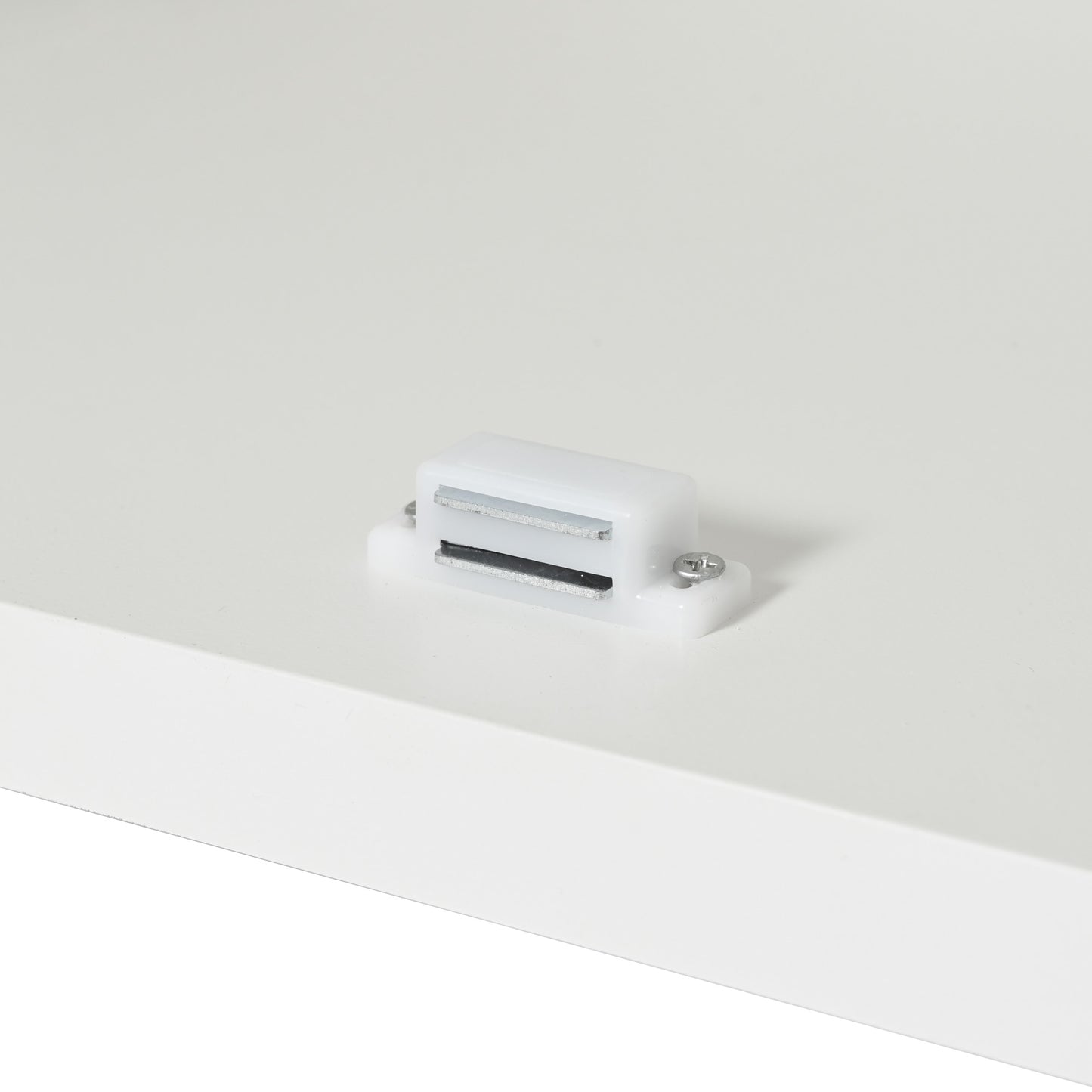 White plastic magnetic catch with silver metal strips ideal for cabinet doors