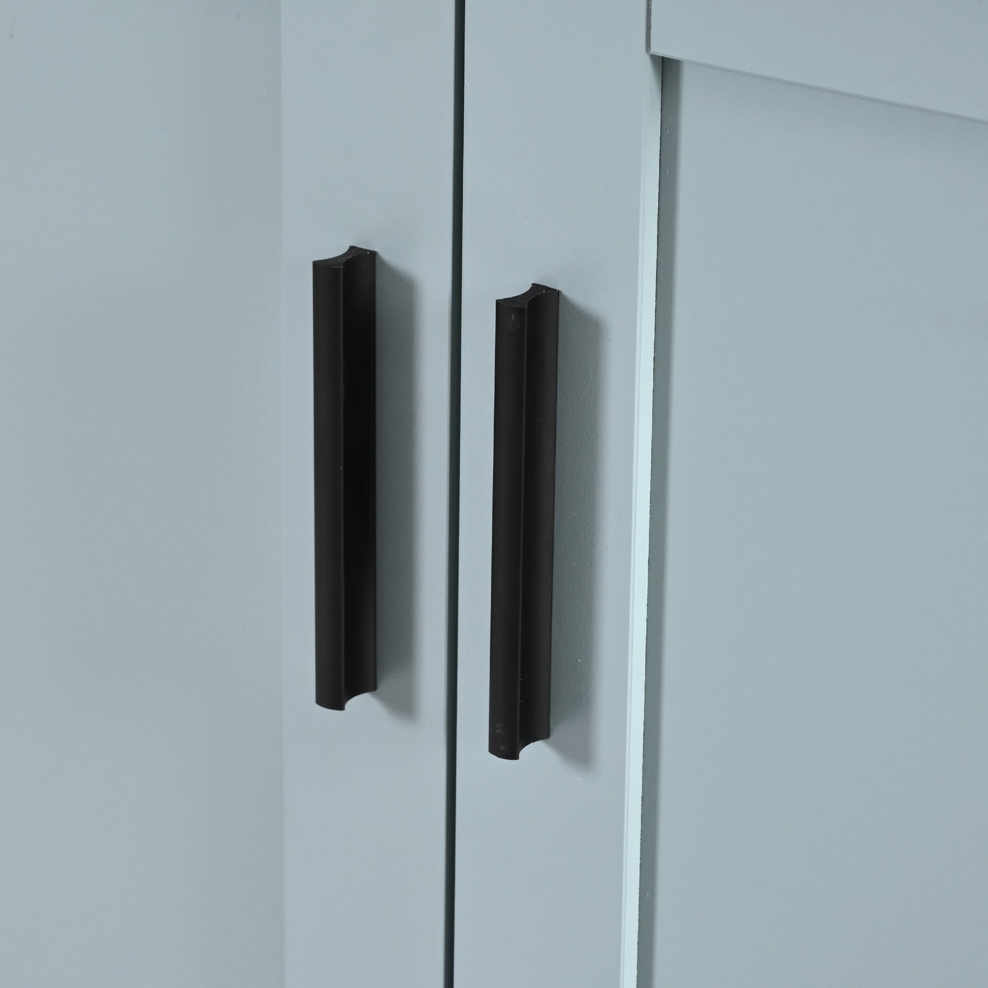 Pair of modern black bar cabinet pulls on light gray doors