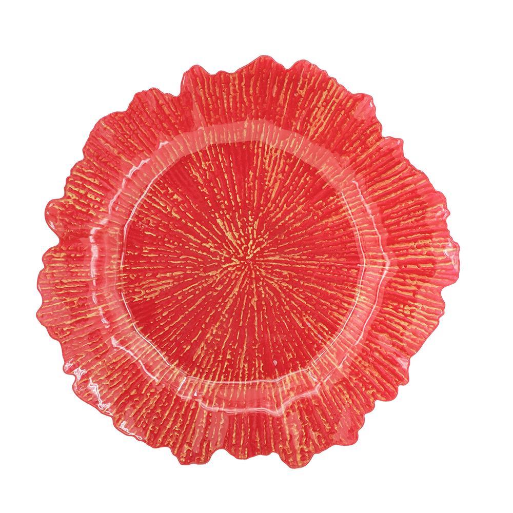 Red glass charger plate with fluted rim and sunburst texture