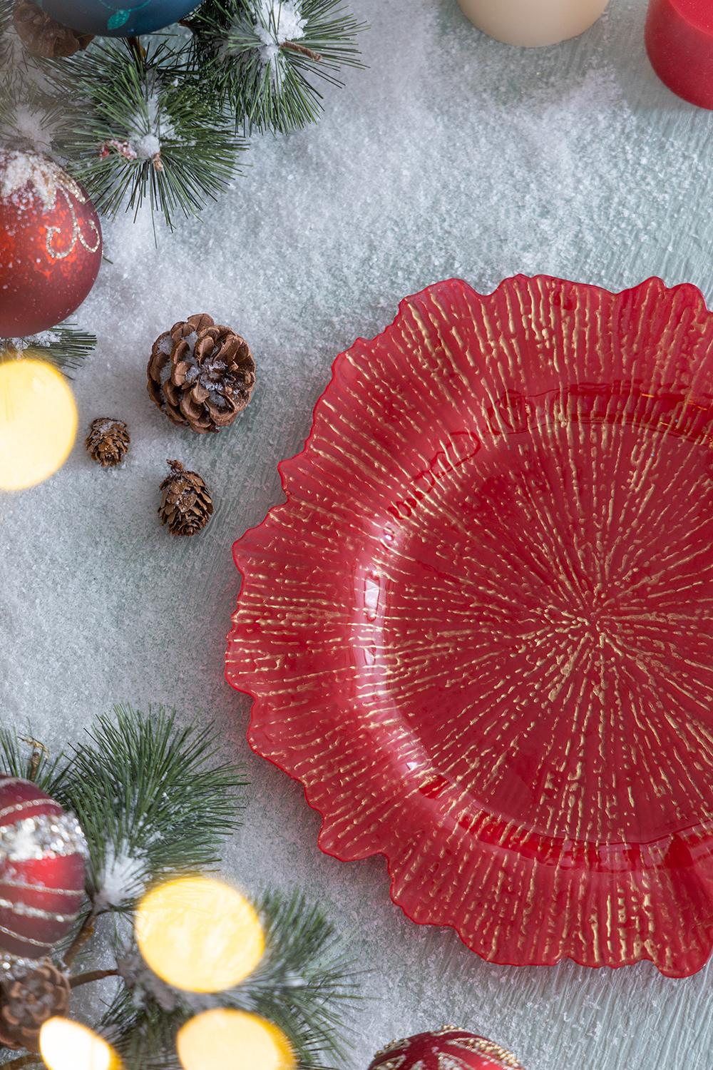 Red glass charger plate with gold textured rim perfect for holiday table settings
