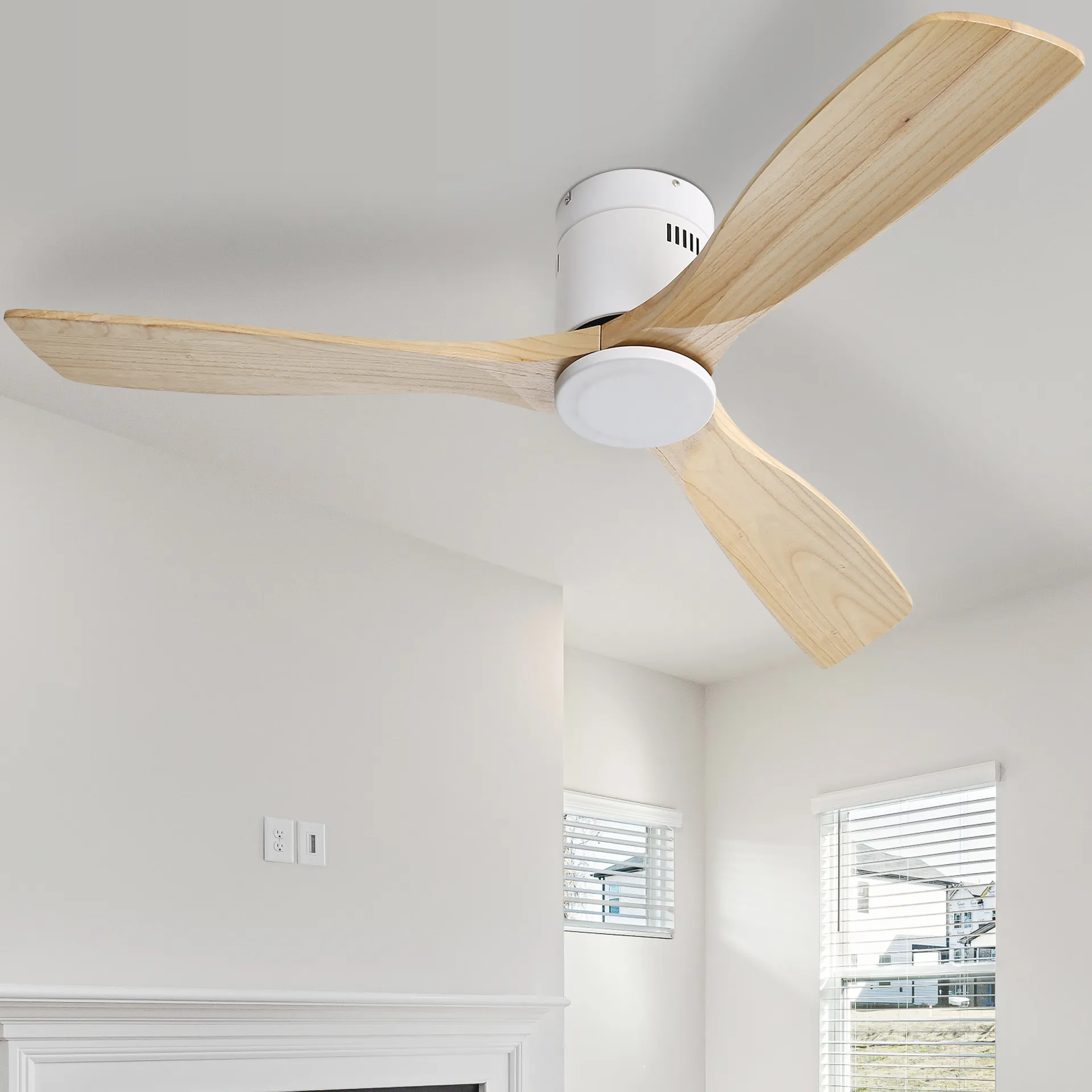 Modern flush mount ceiling fan with three natural wood blades and white motor housing