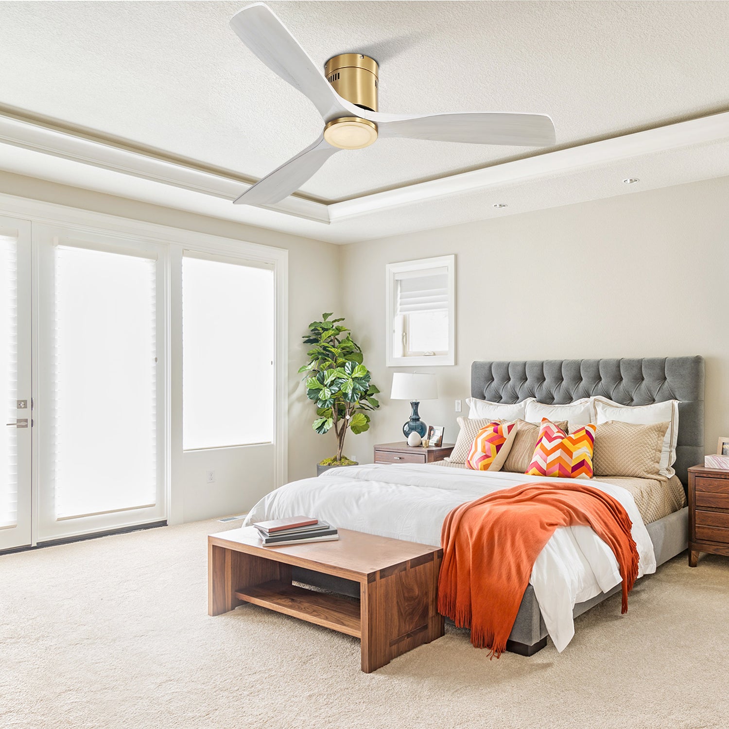 Modern white and gold ceiling fan with three blades in a bedroom setting