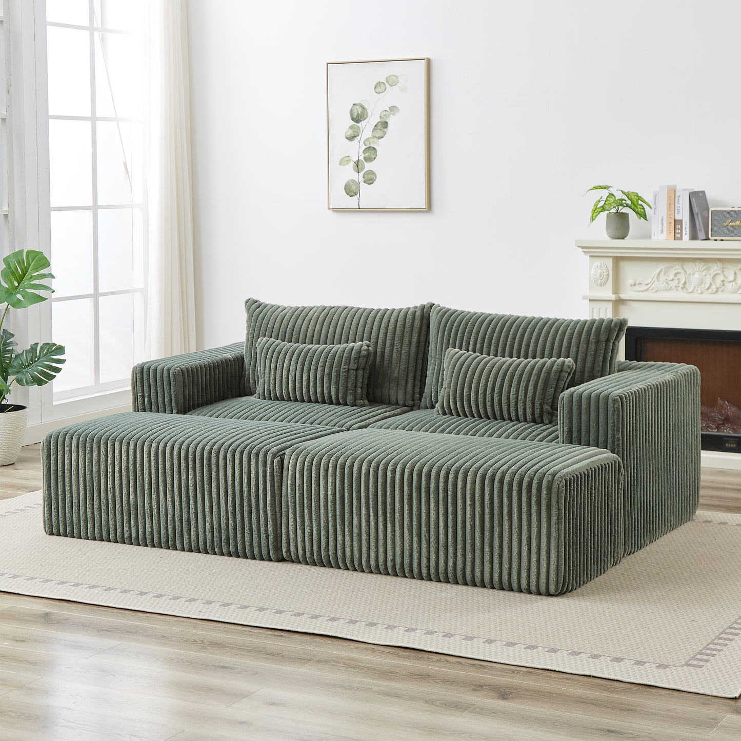 Green corduroy sectional sofa with plush cushions and ottoman