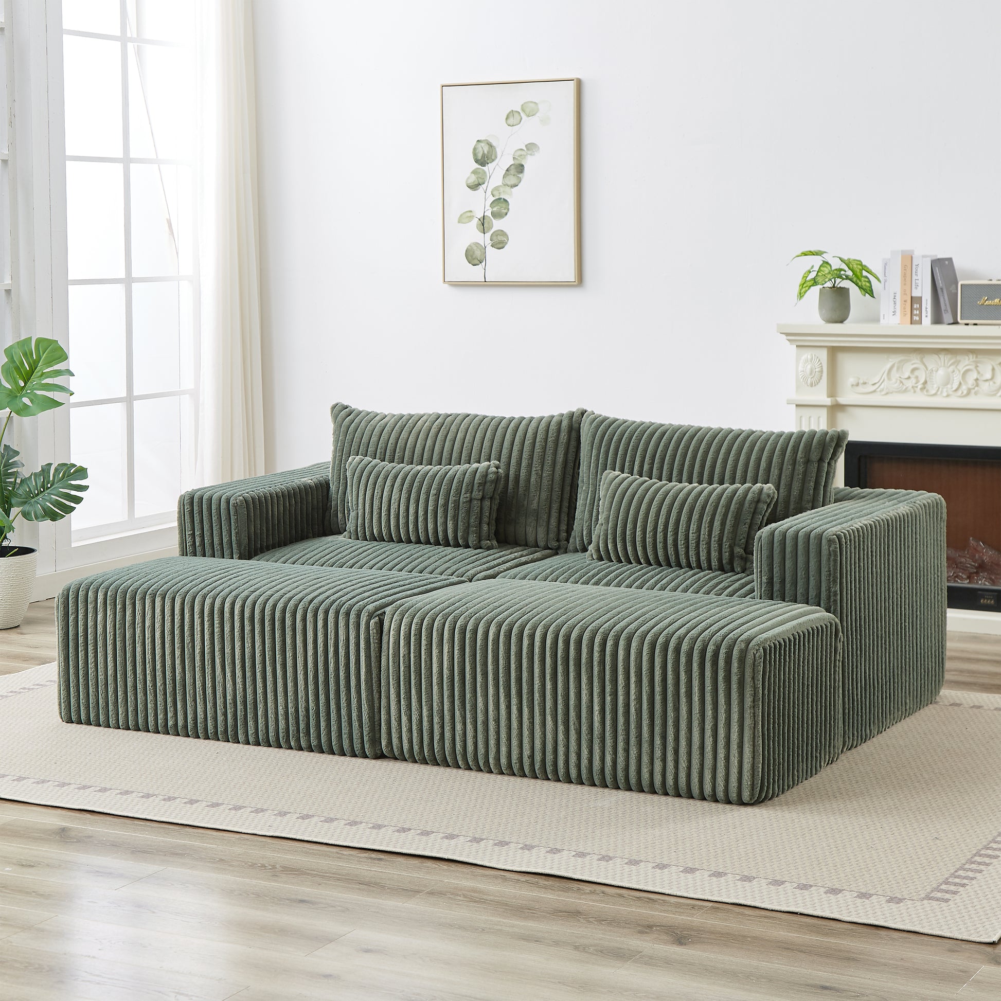 Green corduroy sectional sofa with plush cushions and ottoman