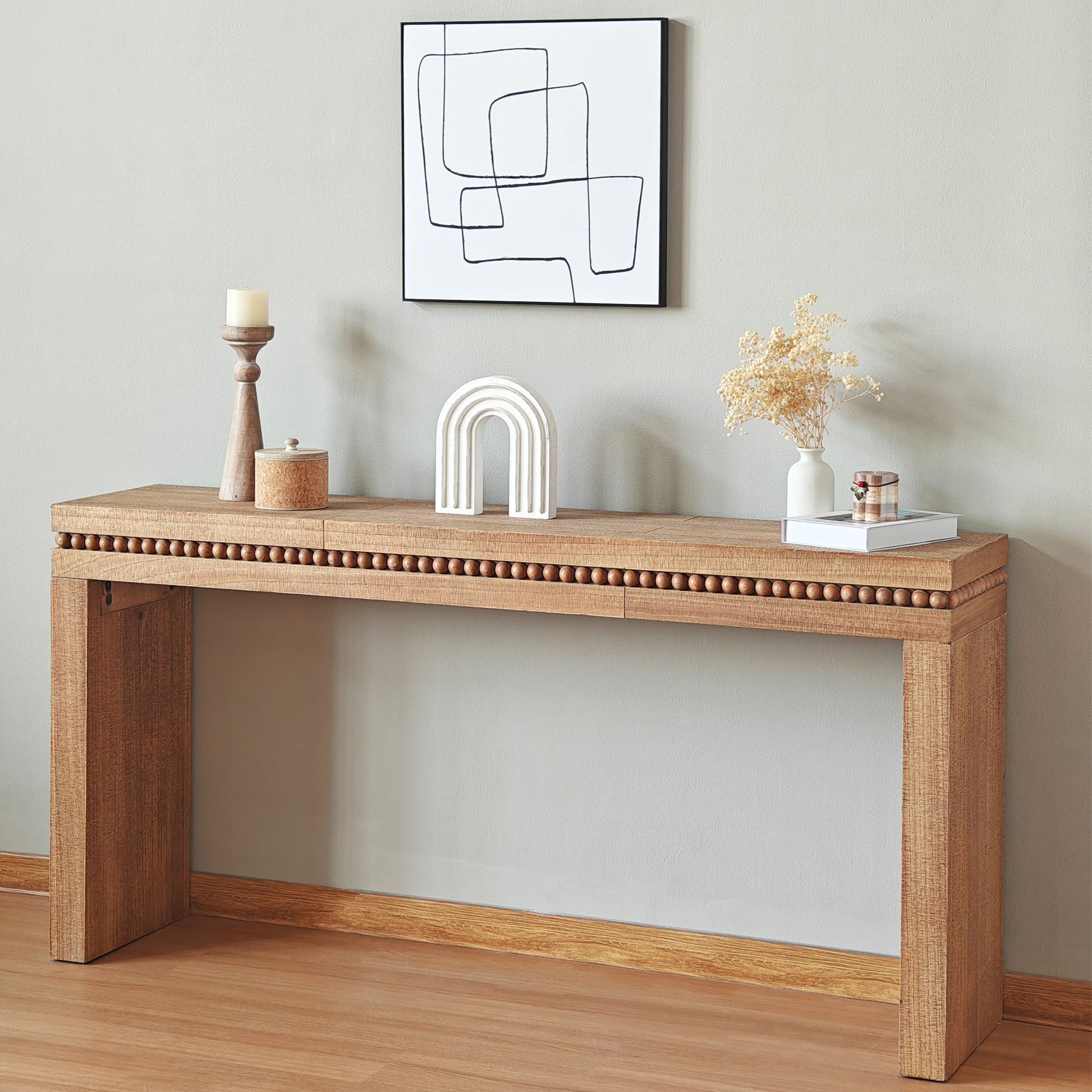 Natural wood console table with beaded trim ideal for entryway decor