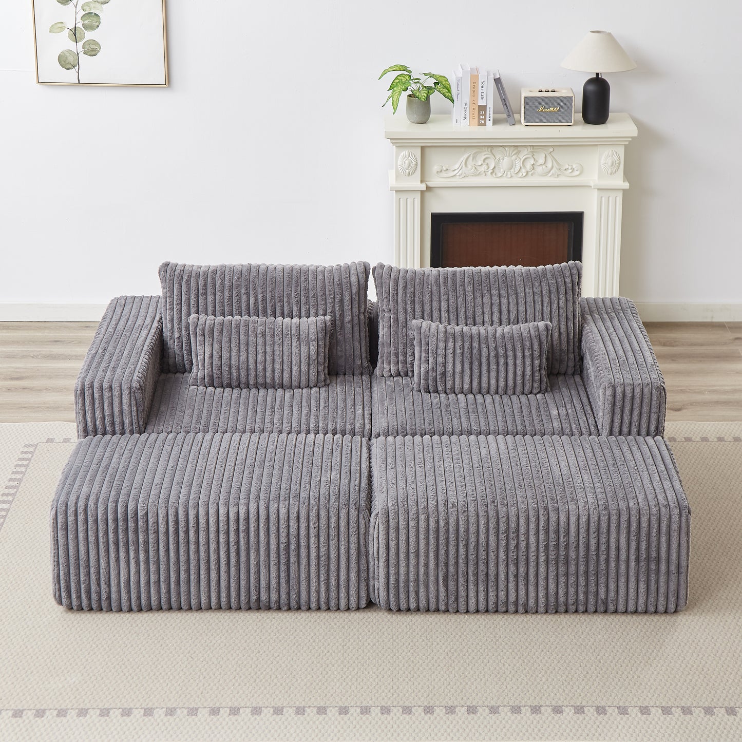 Plush grey corduroy sectional sofa with deep seating and plush cushions perfect for a modern living room