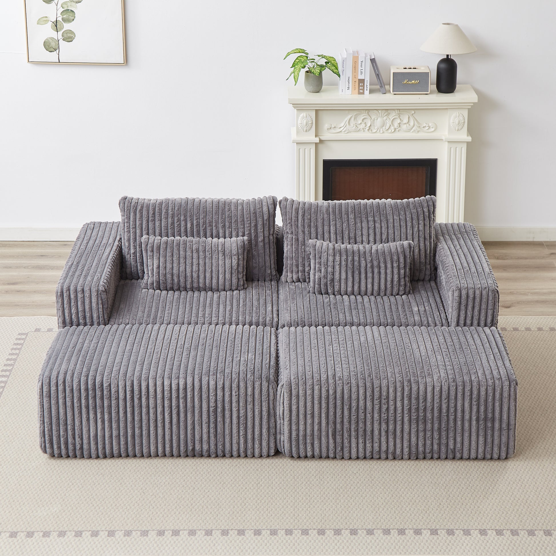 Plush grey corduroy sectional sofa with deep seating and plush cushions perfect for a modern living room