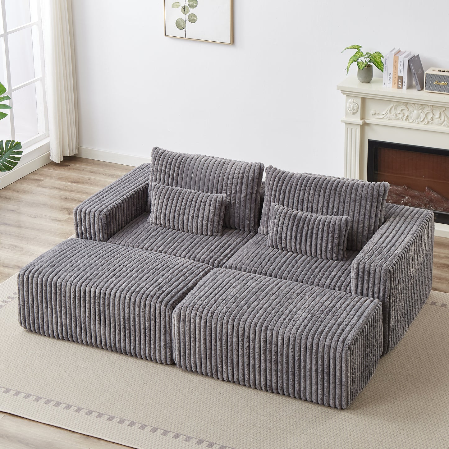 Plush grey corduroy sectional sofa with plush throw pillows perfect for a cozy living room setup