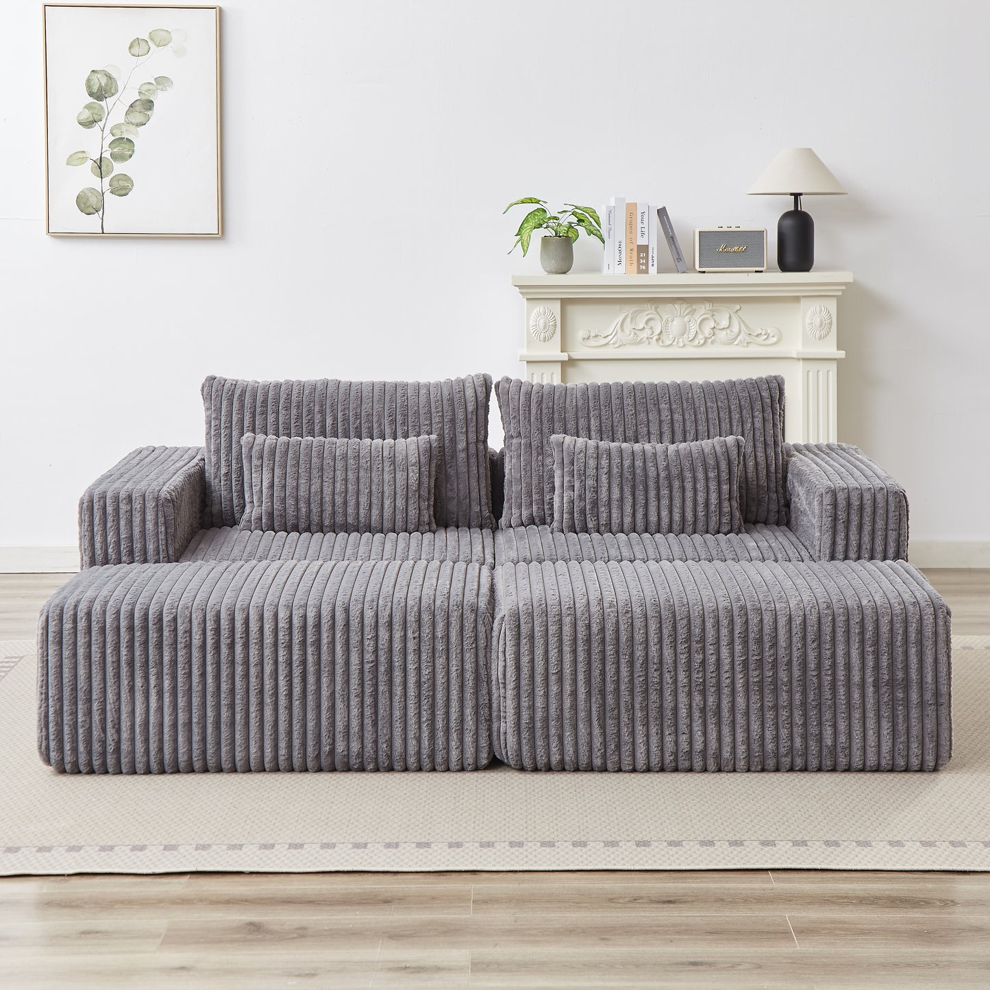 Plush grey modular sofa with corduroy texture and matching throw pillows perfect for modern living rooms