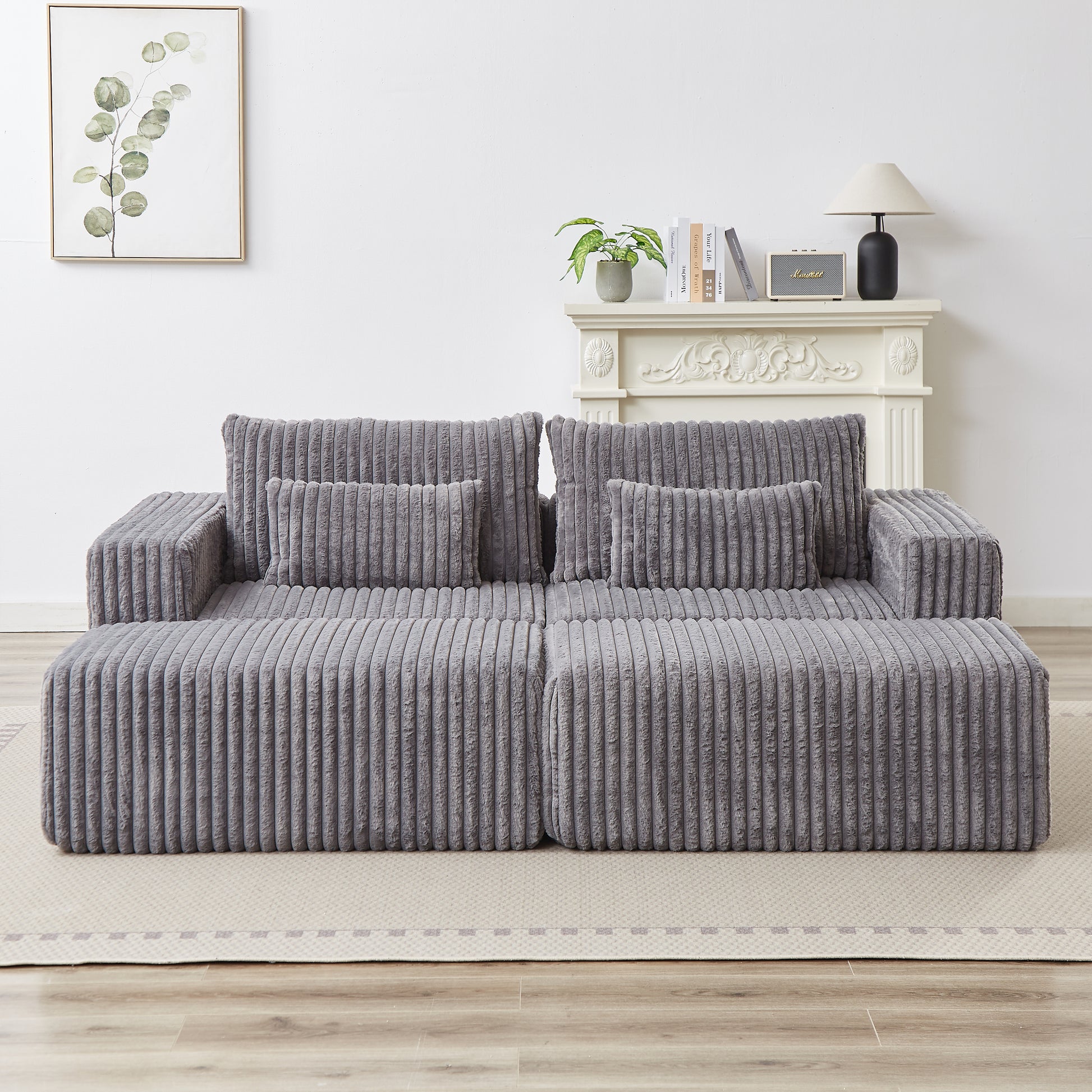 Plush grey modular sofa with corduroy texture and matching throw pillows perfect for modern living rooms