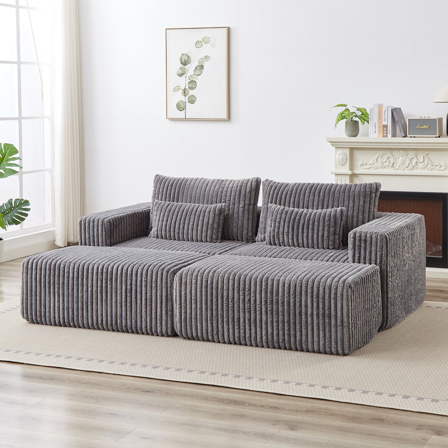 Plush grey corduroy sectional sofa with movable ottoman for flexible living room arrangements